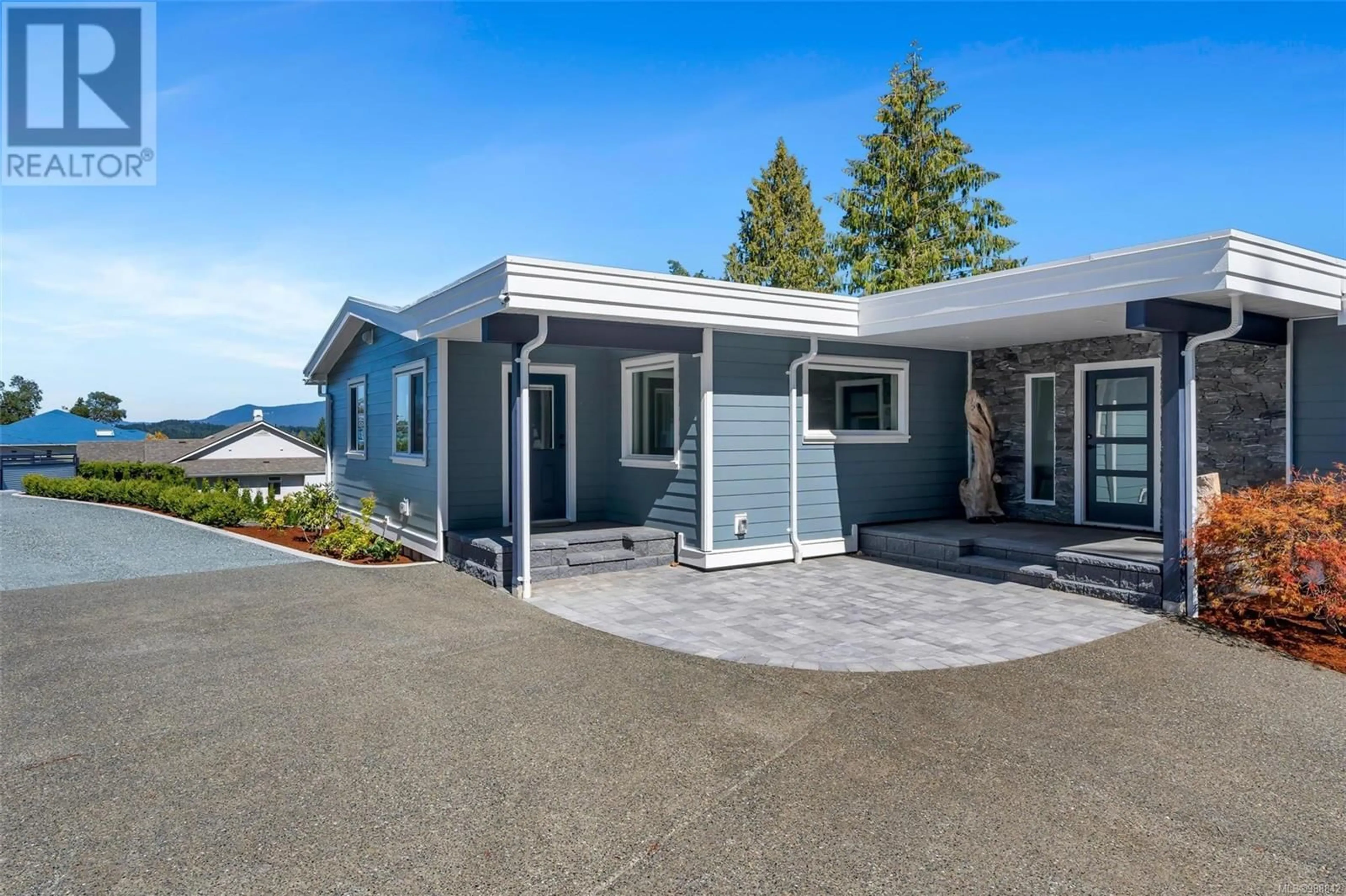Home with vinyl exterior material, street for 667 NOOWICK ROAD, Mill Bay British Columbia V8H1G5