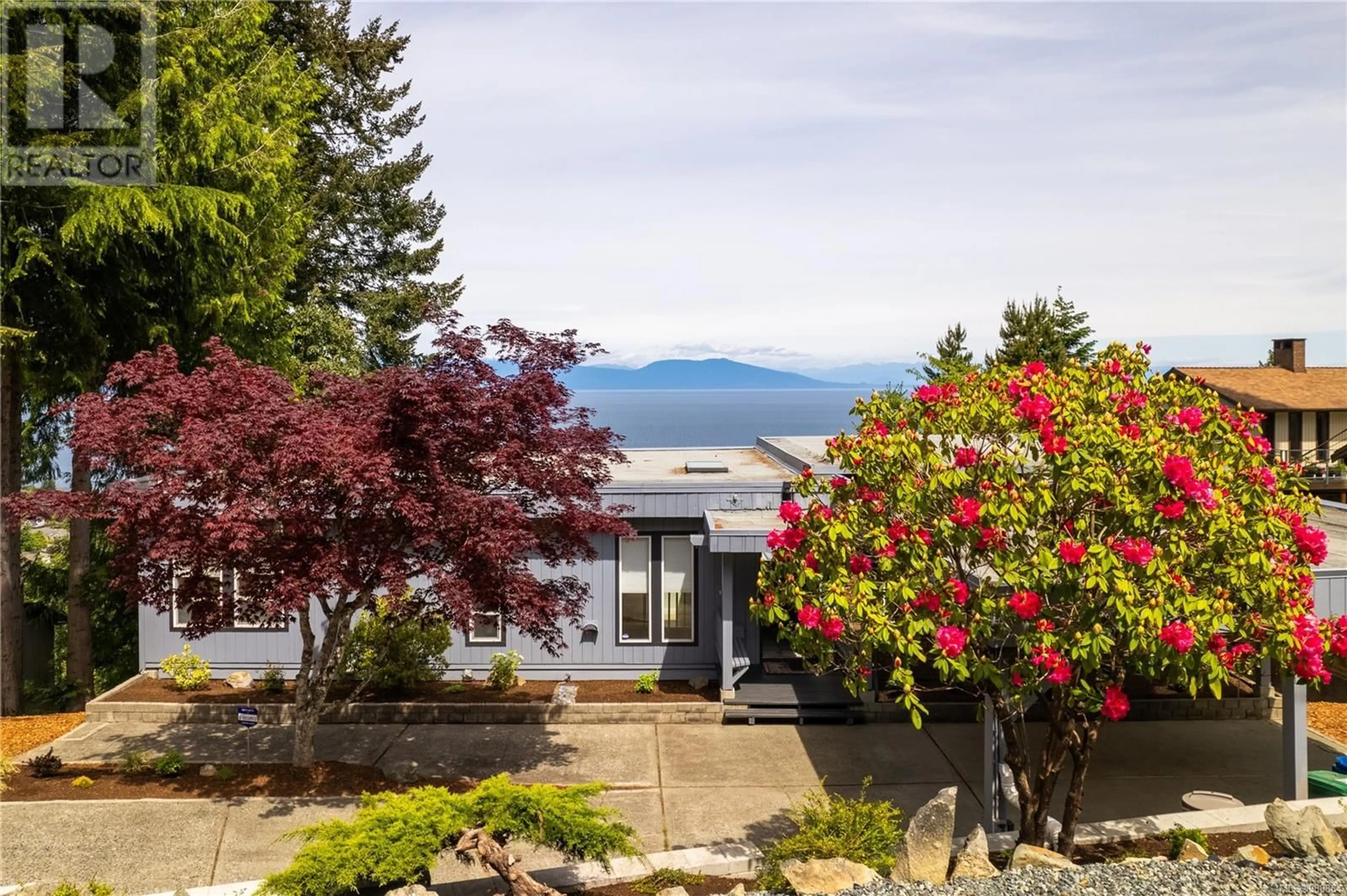 A pic from outside/outdoor area/front of a property/back of a property/a pic from drone, mountain view for 4824 Blue Jay Trail, Nanaimo British Columbia V9T5C9