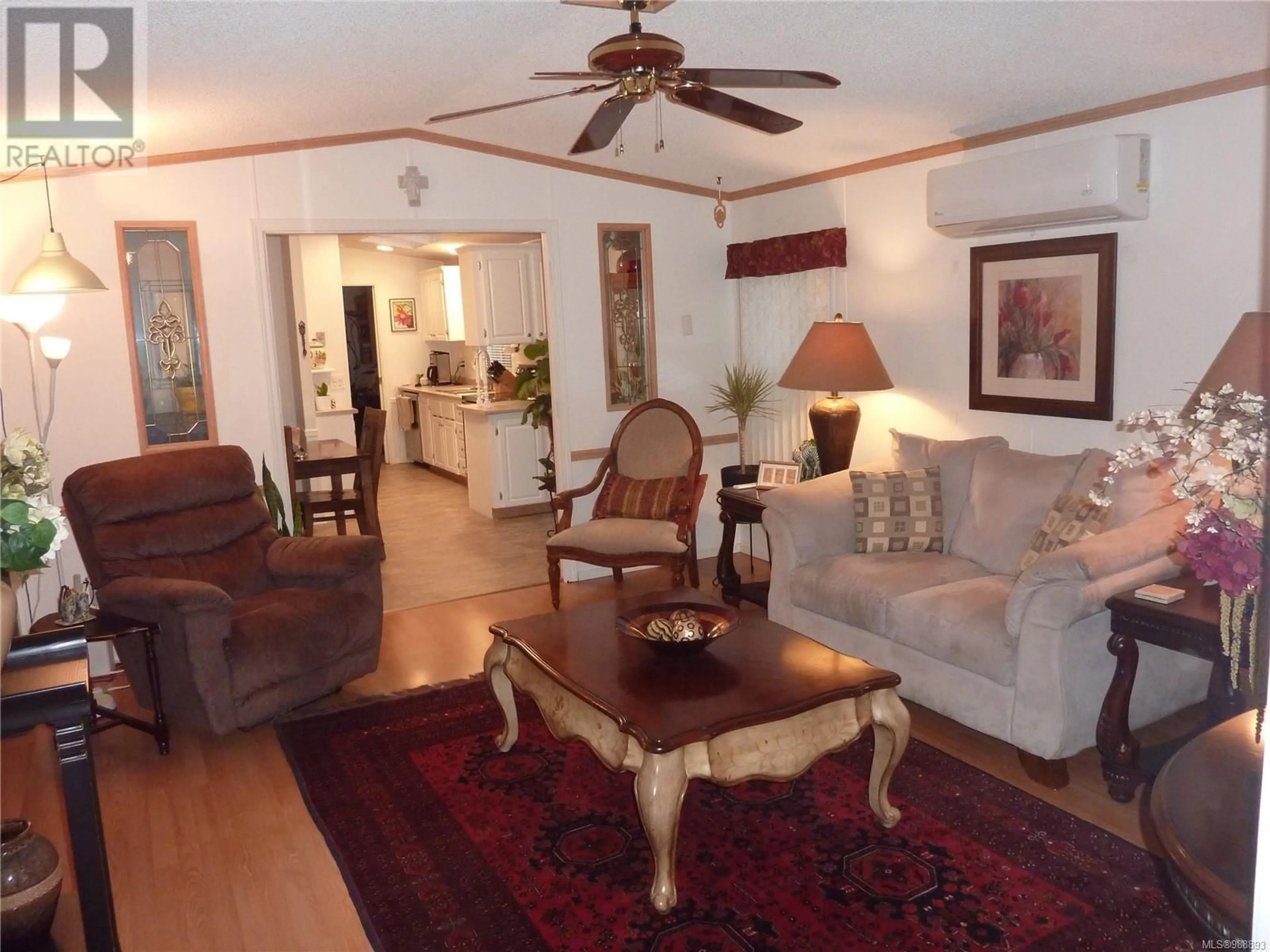 Living room with furniture, wood/laminate floor for 25 7509 Central Saanich Rd, Central Saanich British Columbia V8M2B5