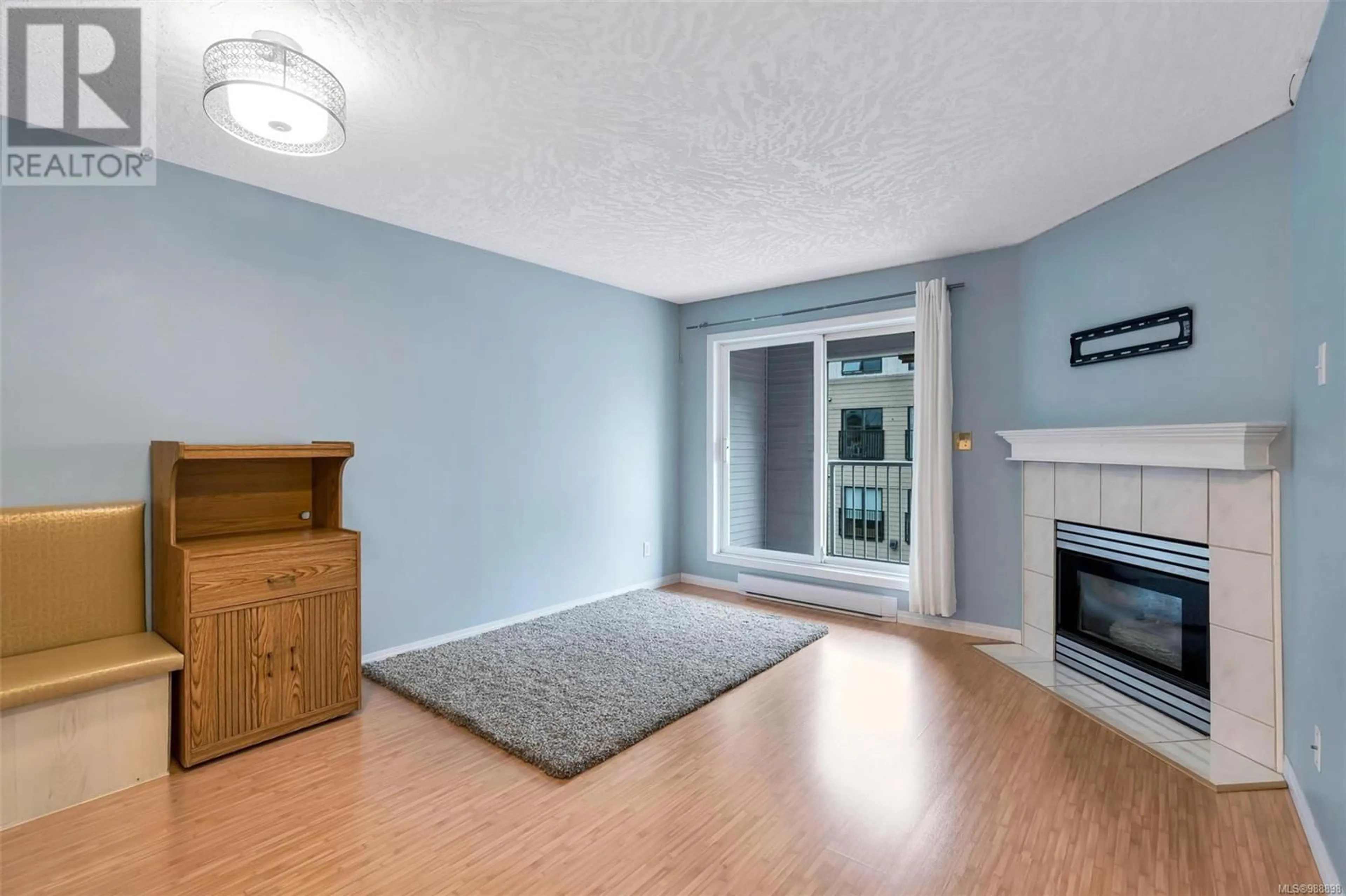 Living room with furniture, wood/laminate floor for 305 3008 Washington Ave, Victoria British Columbia V9A1P6