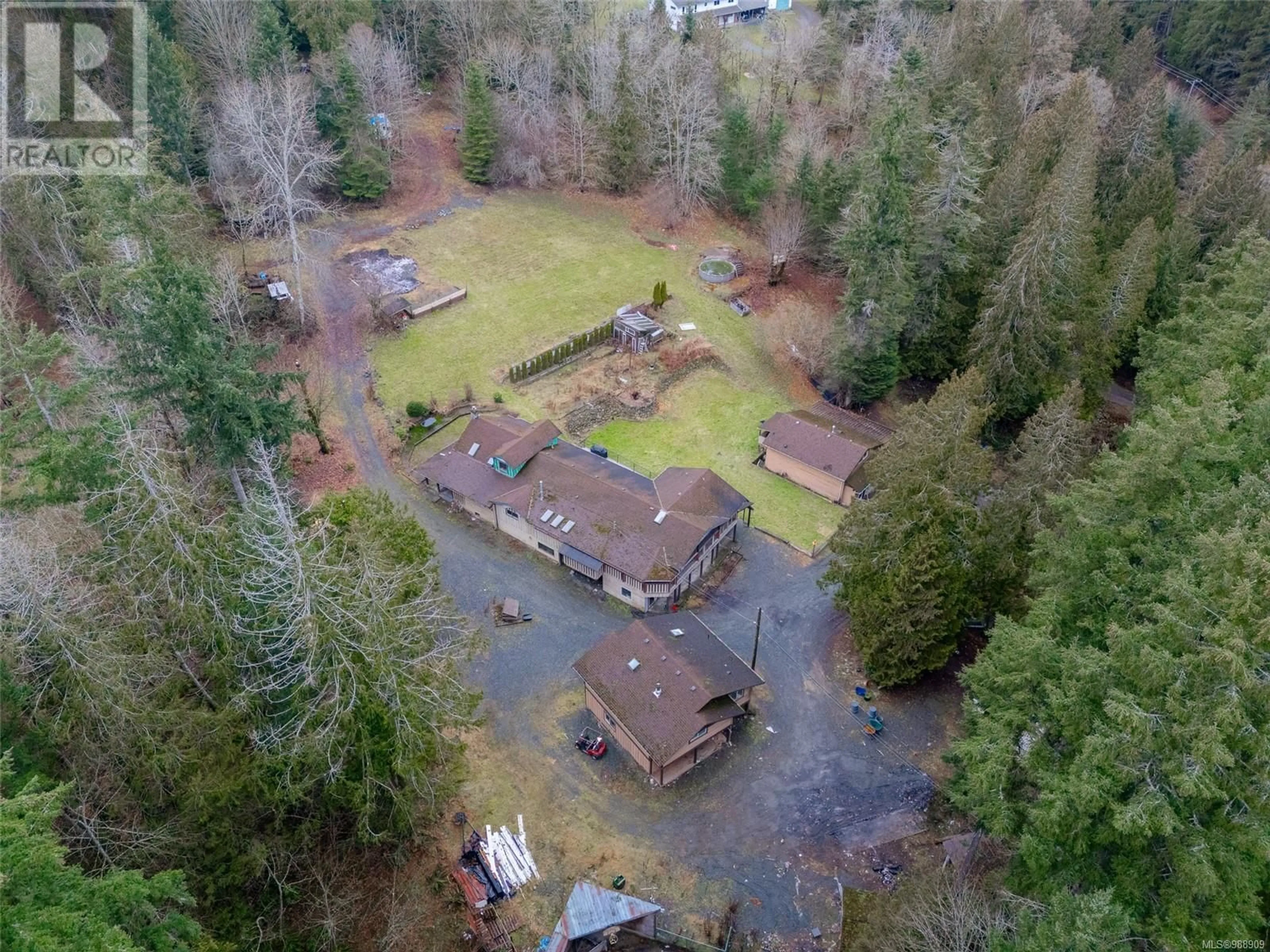 A pic from outside/outdoor area/front of a property/back of a property/a pic from drone, forest/trees view for 2477 Enefer Rd, Nanaimo British Columbia V9X1W4