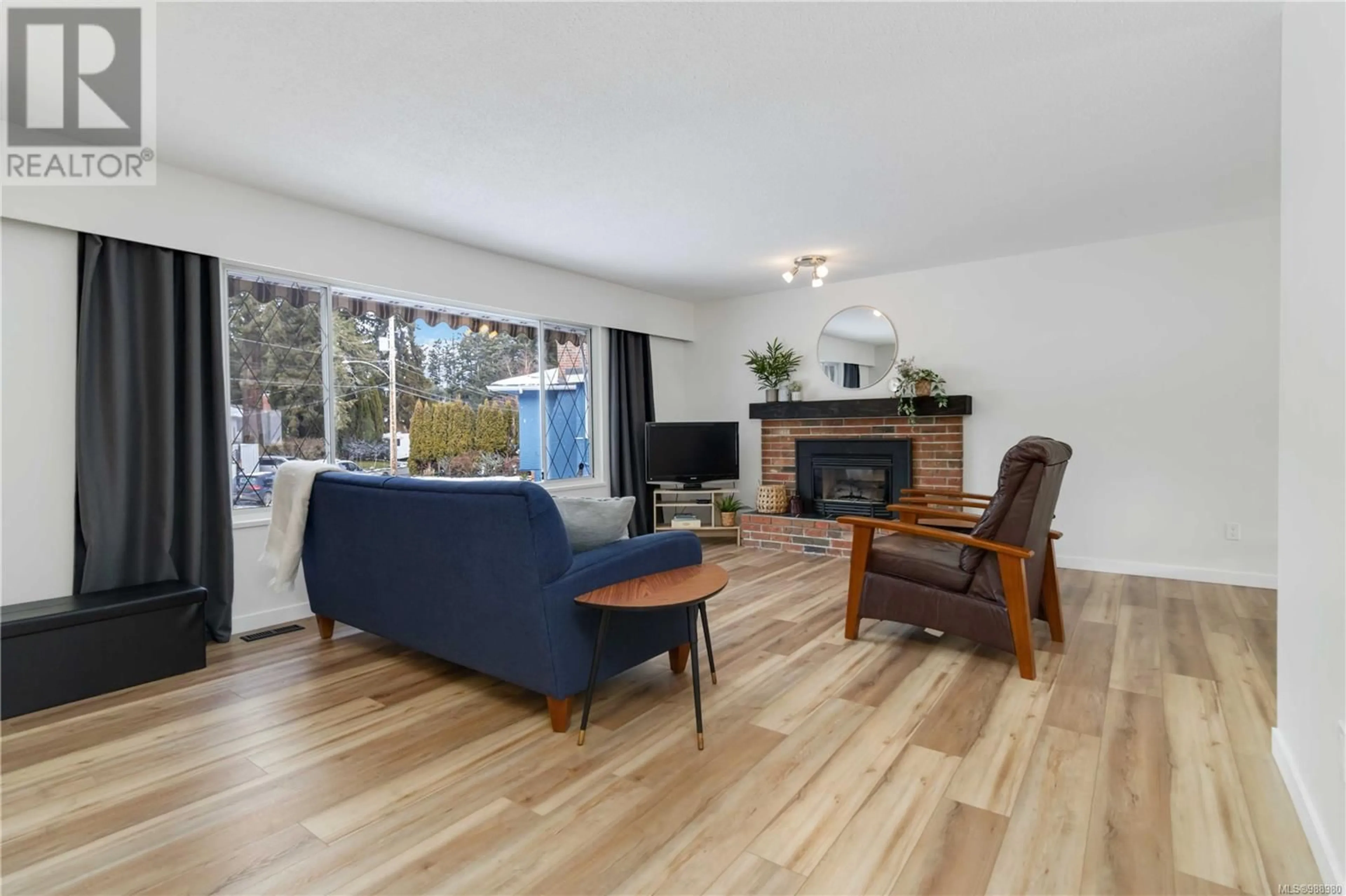 Living room with furniture, wood/laminate floor for 2781 Penelope Pl, Langford British Columbia V9B3K3