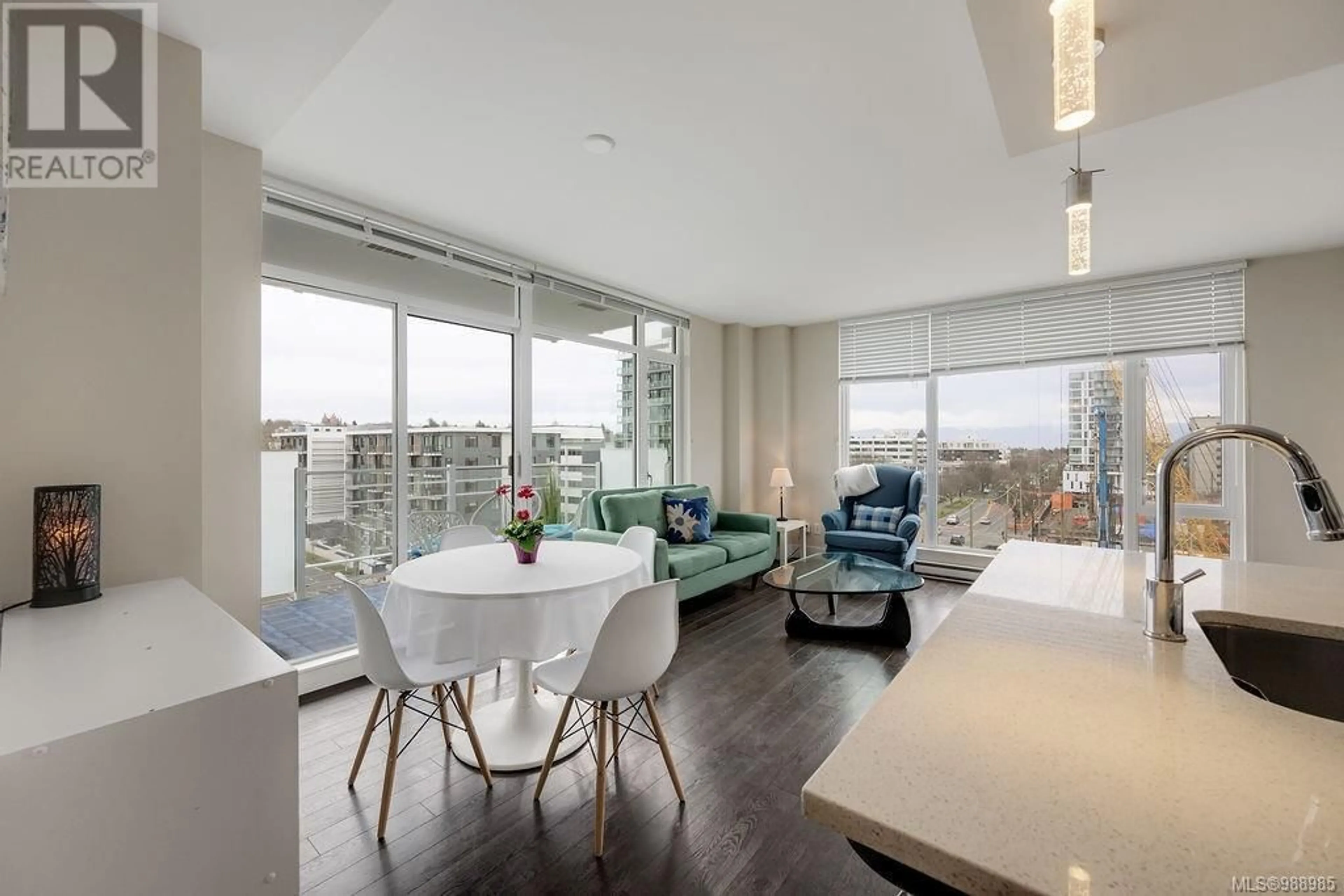 Living room with furniture, wood/laminate floor for 602 - 1090 JOHNSON STREET, Victoria British Columbia V8V0B3