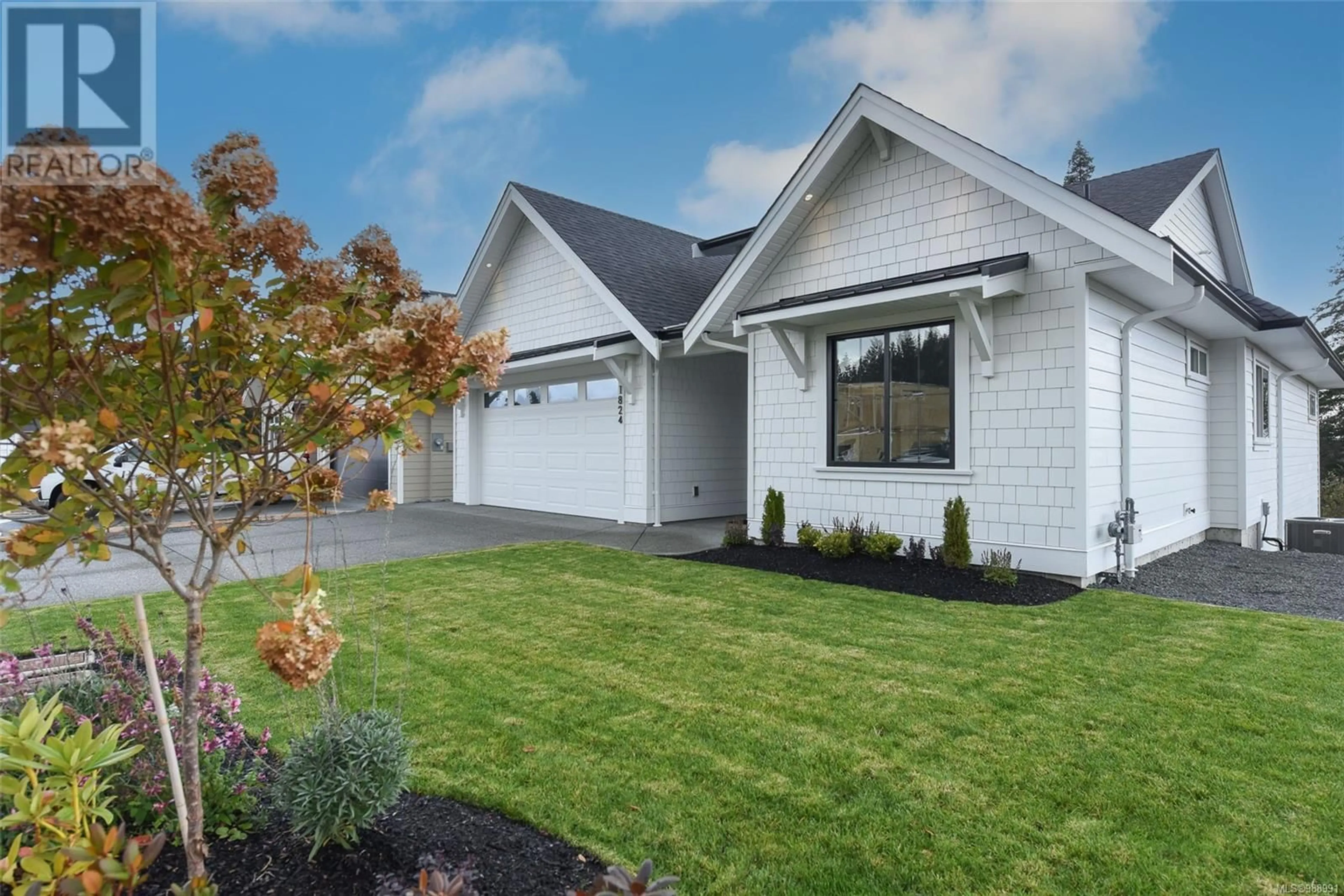 Home with vinyl exterior material, street for 1824 CROWN ISLE BOULEVARD, Courtenay British Columbia V9N0K1