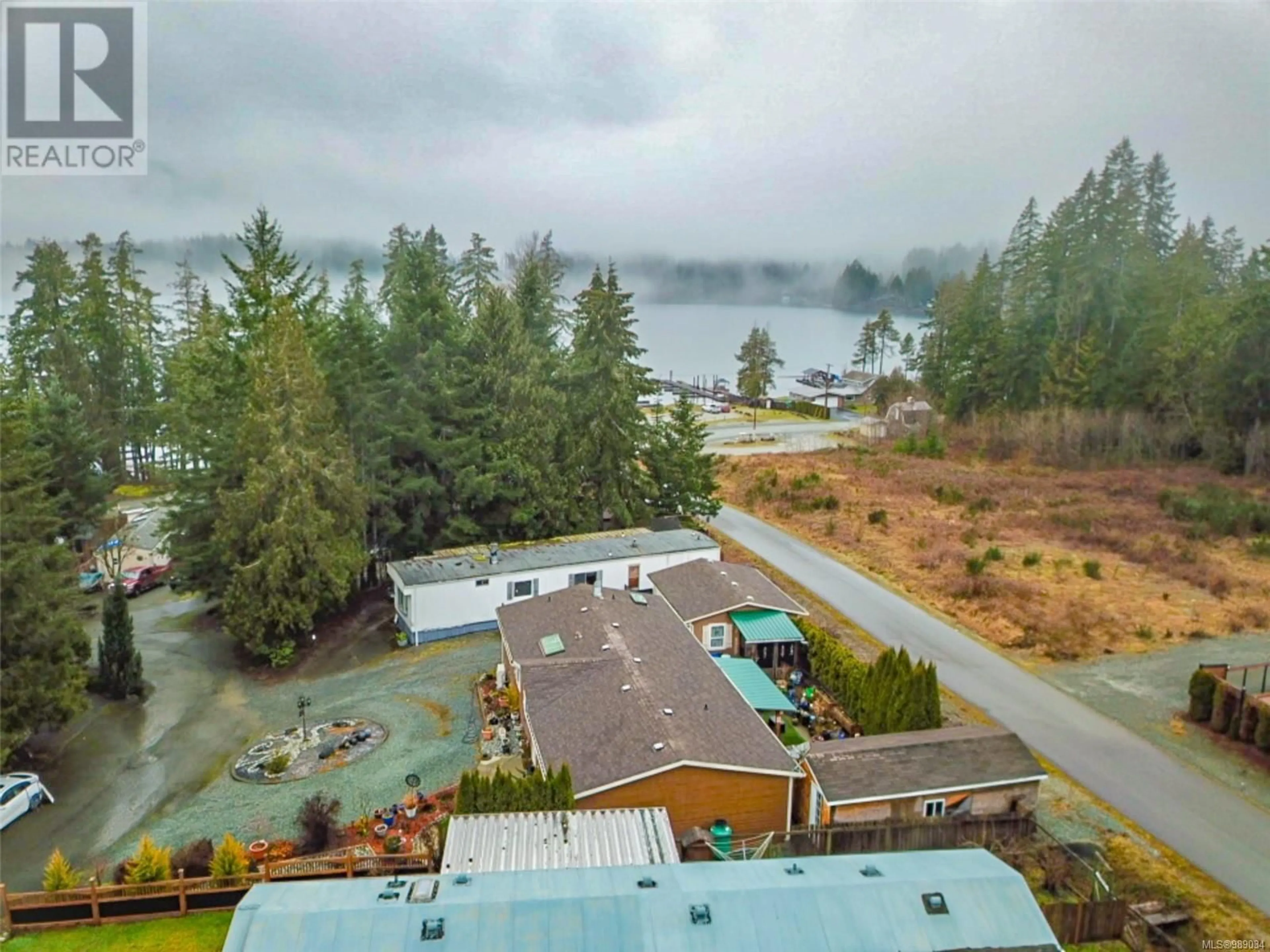 A pic from outside/outdoor area/front of a property/back of a property/a pic from drone, water/lake/river/ocean view for 56 - 10325 LAKESHORE ROAD, Port Alberni British Columbia V9Y8G9