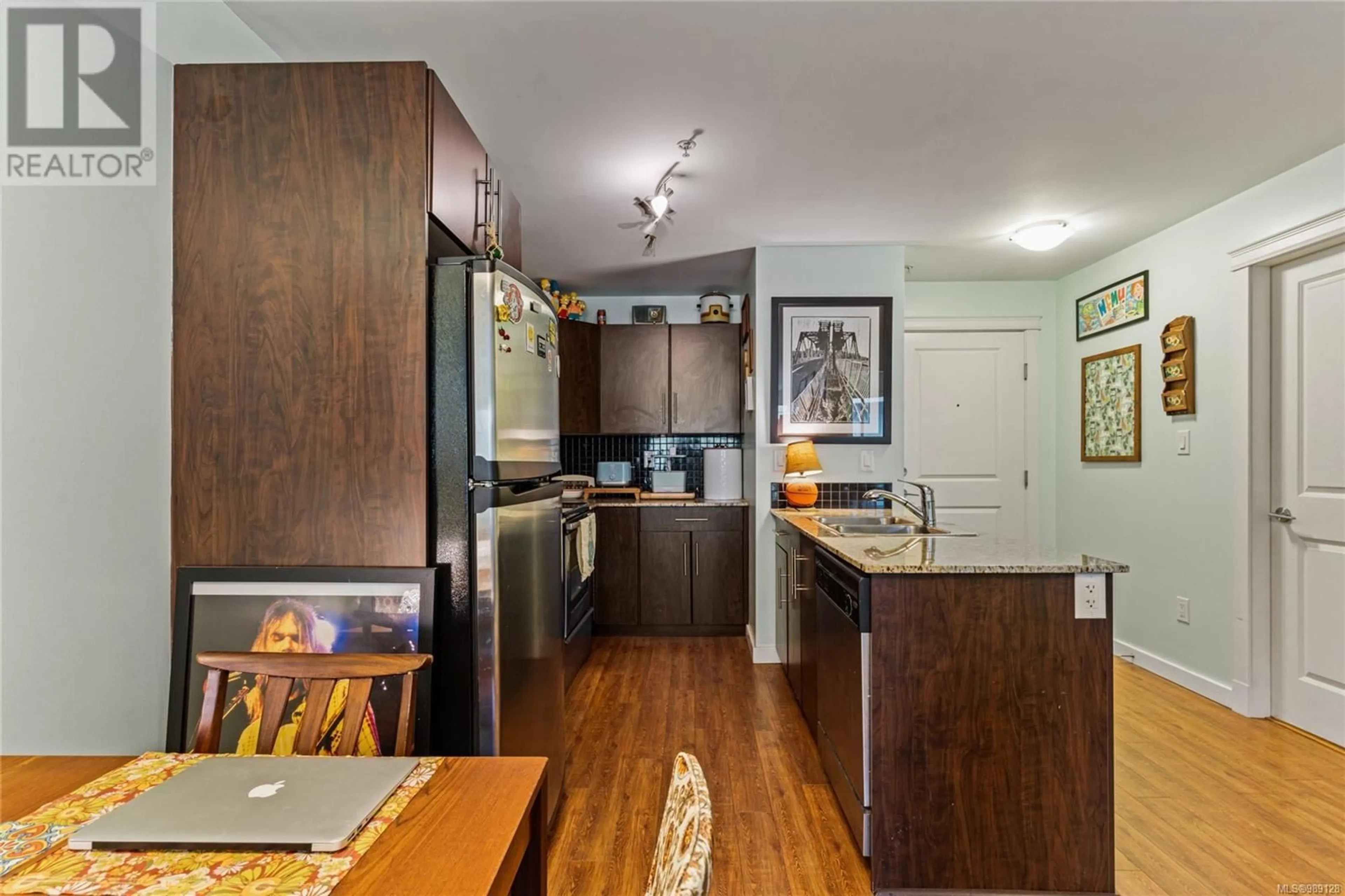 Open concept kitchen, wood/laminate floor for 404 - 1405 ESQUIMALT ROAD, Esquimalt British Columbia V9A0A4