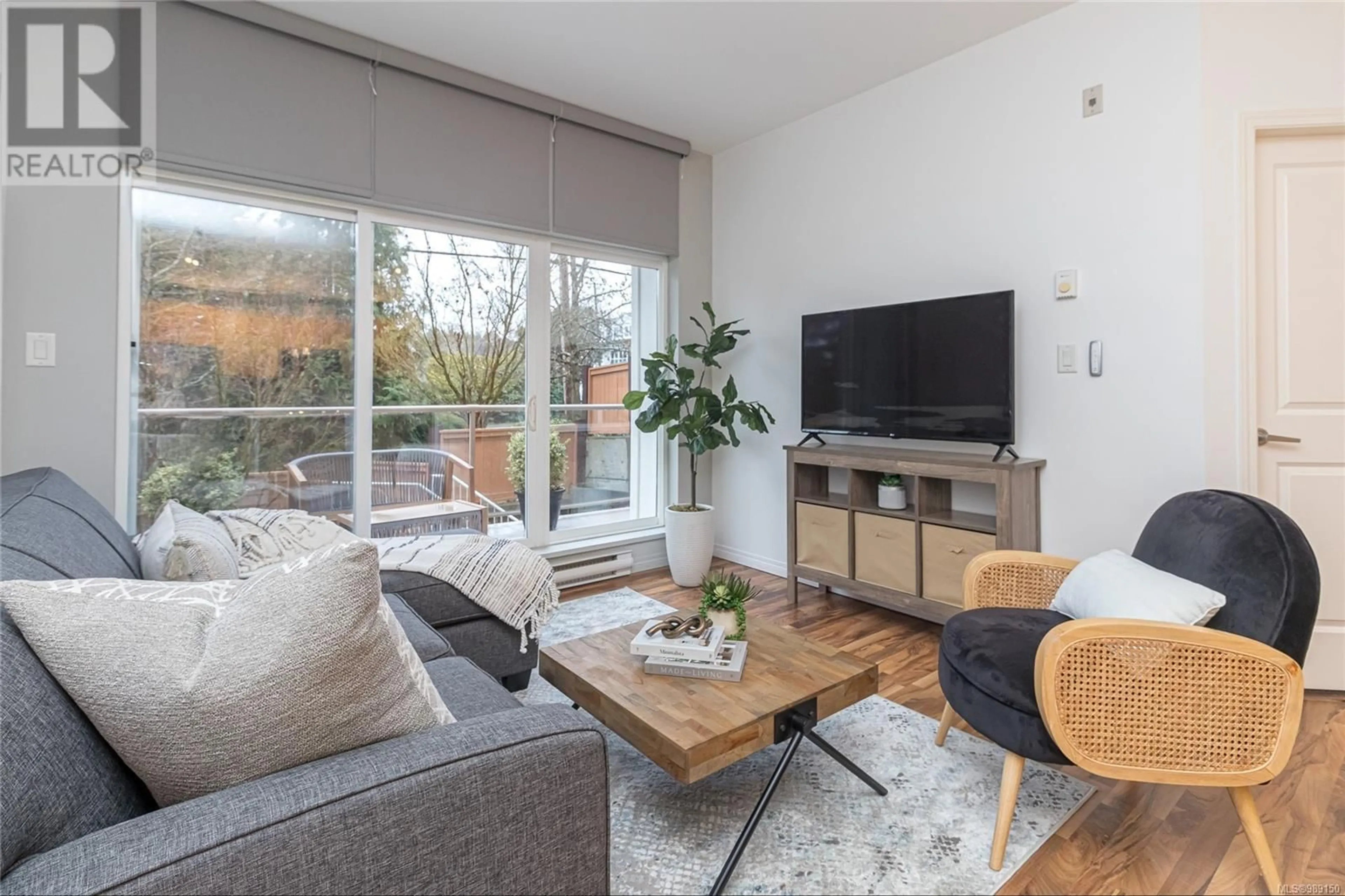 Living room with furniture, wood/laminate floor for 205 1550 Church Ave, Saanich British Columbia V8P2H1