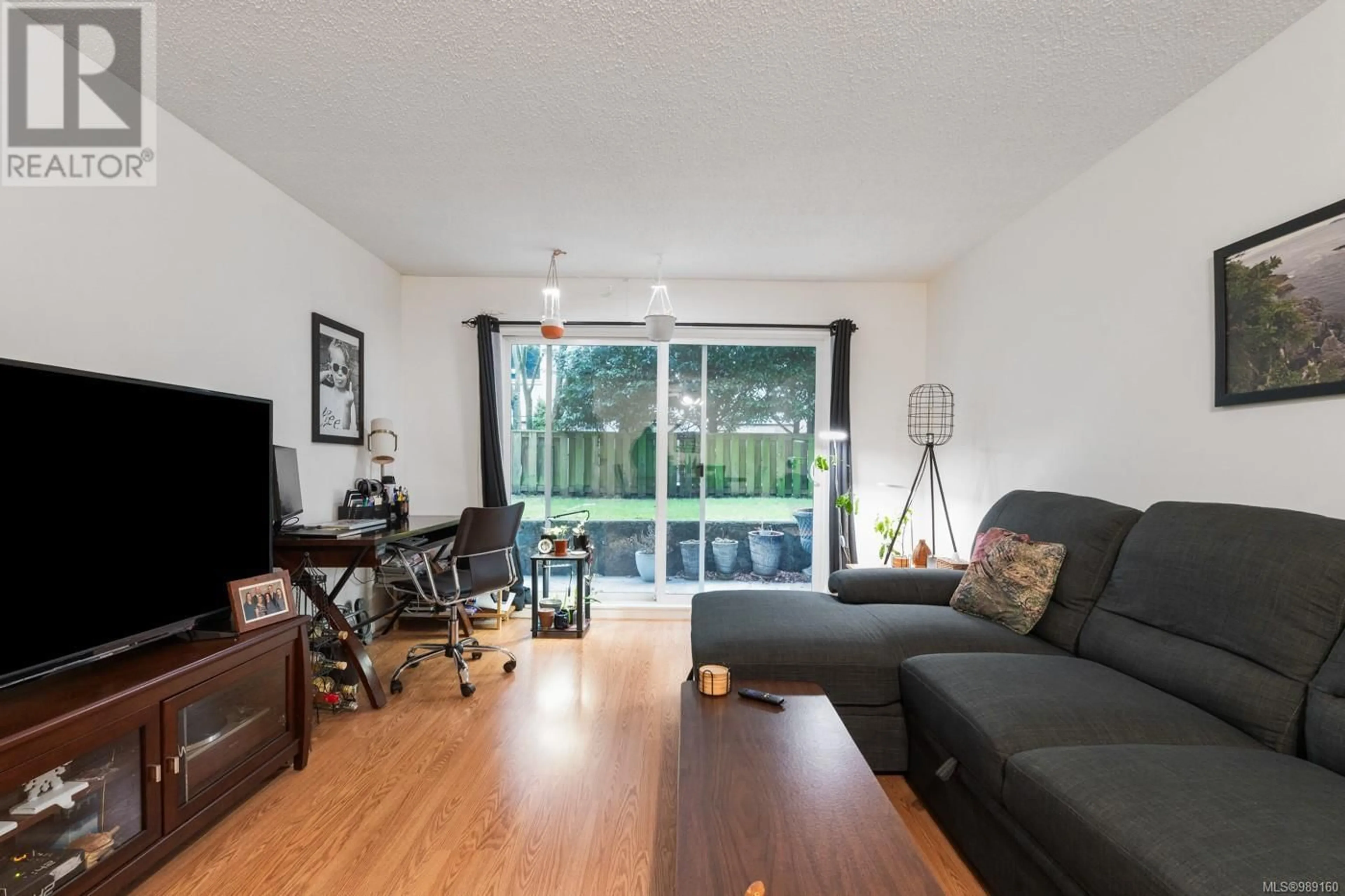 Living room with furniture, wood/laminate floor for 103 1342 Hillside Ave, Victoria British Columbia V8T2B4