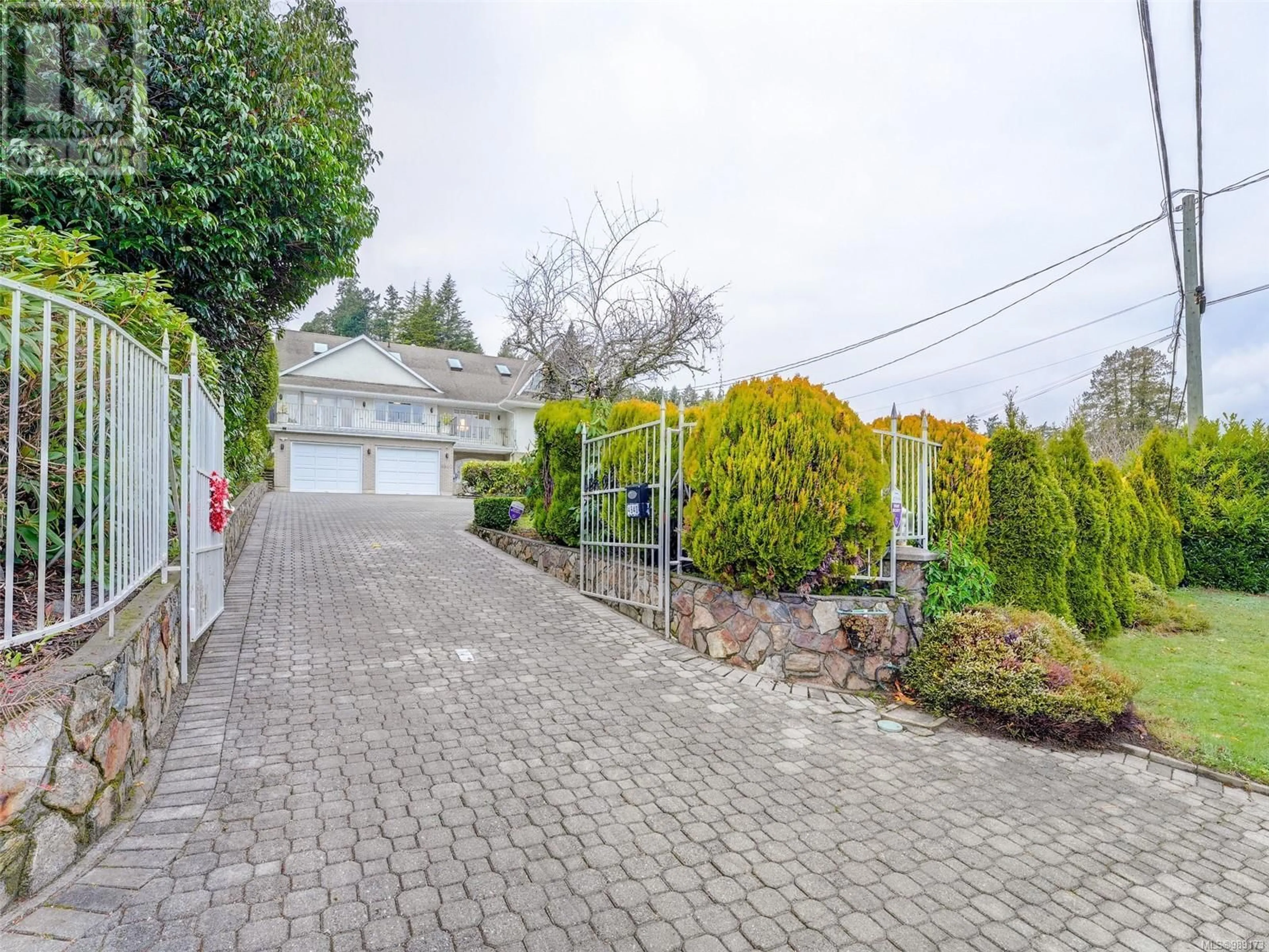 A pic from outside/outdoor area/front of a property/back of a property/a pic from drone, street for 4940 Cordova Bay Rd, Saanich British Columbia V8Y2K2