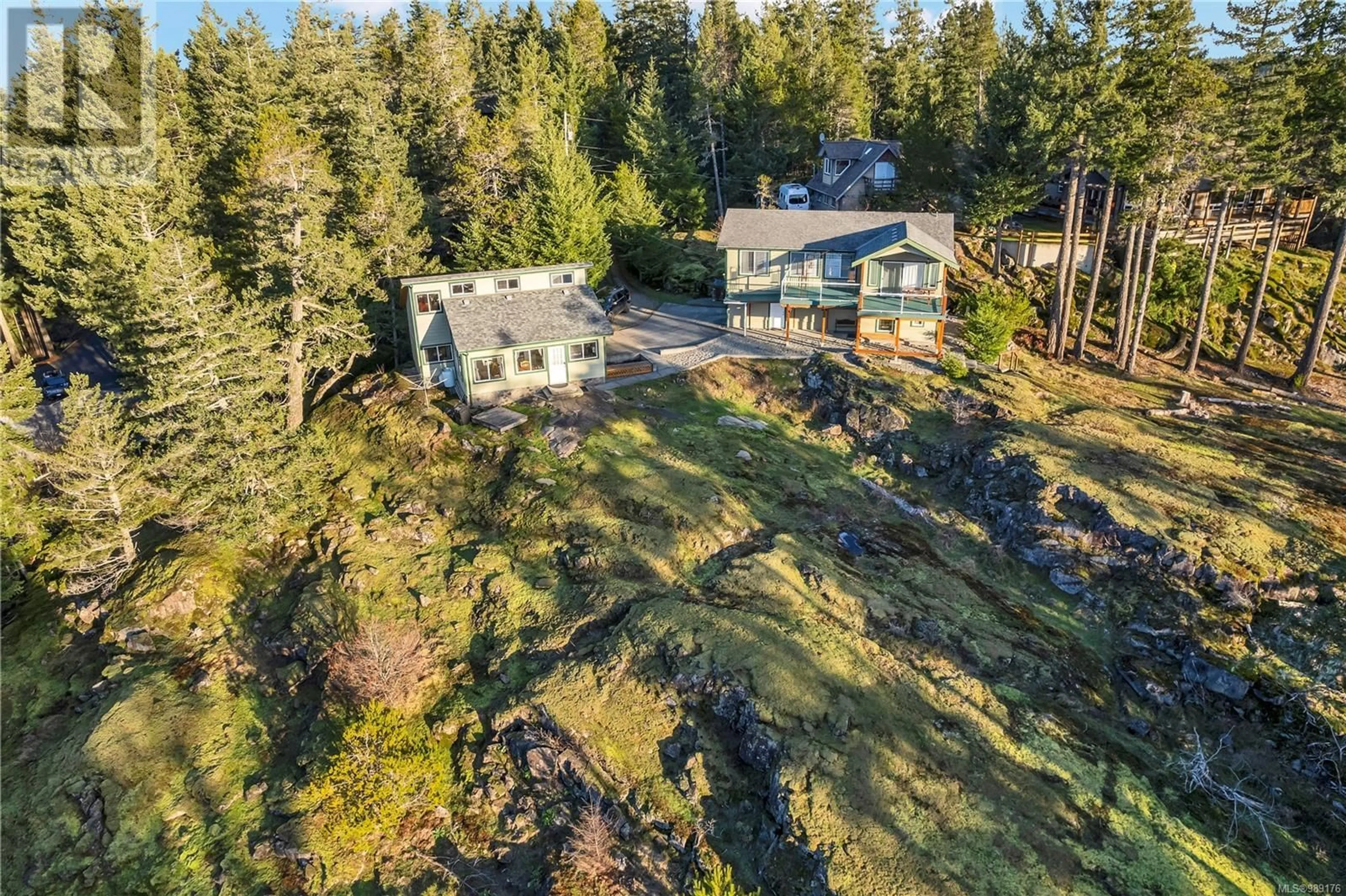 A pic from outside/outdoor area/front of a property/back of a property/a pic from drone, forest/trees view for 5 620 Helanton Rd, Quadra Island British Columbia V0P1N0