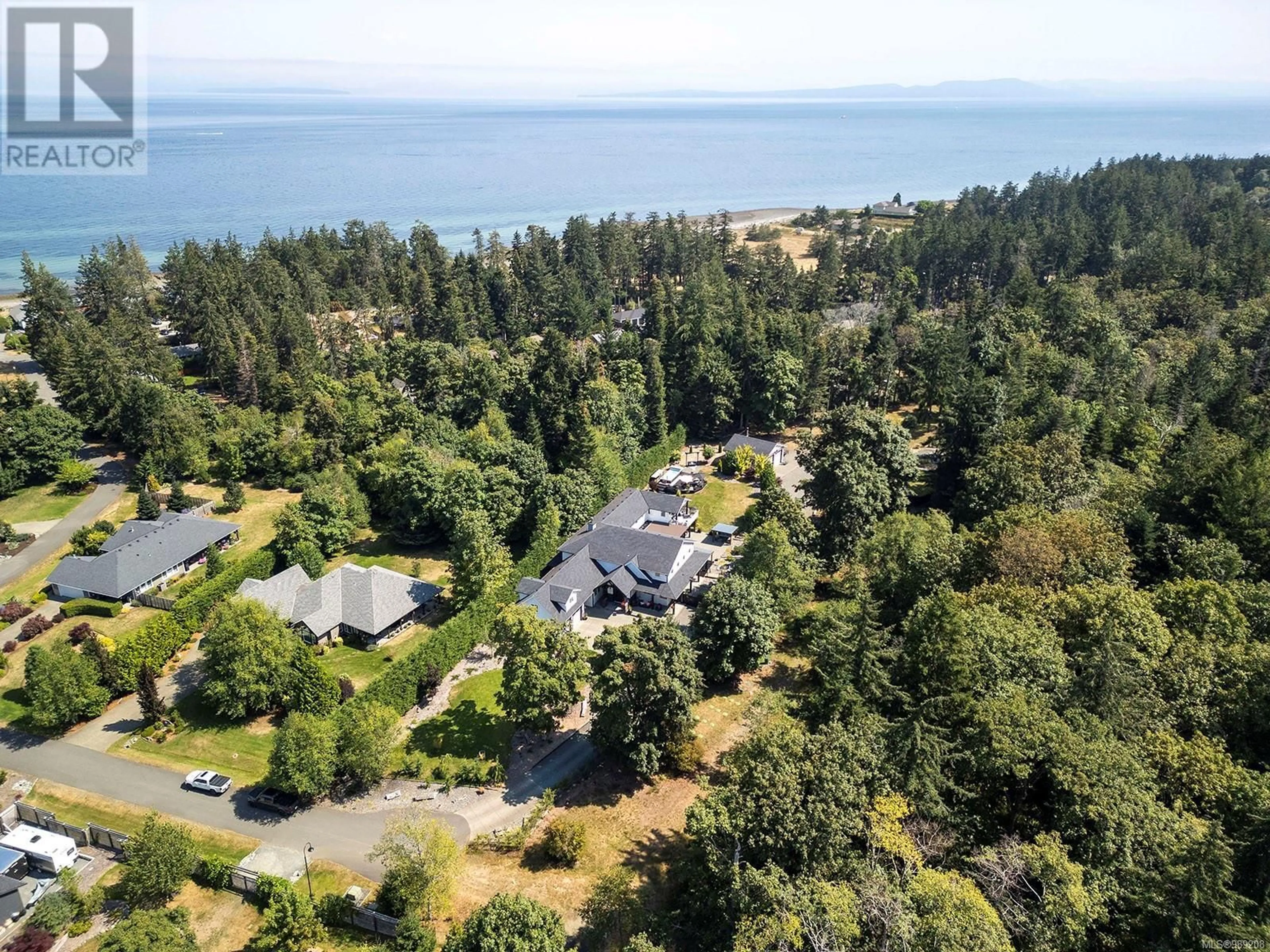 A pic from outside/outdoor area/front of a property/back of a property/a pic from drone, water/lake/river/ocean view for 1710 Kincora Grove, Comox British Columbia V9M4C5