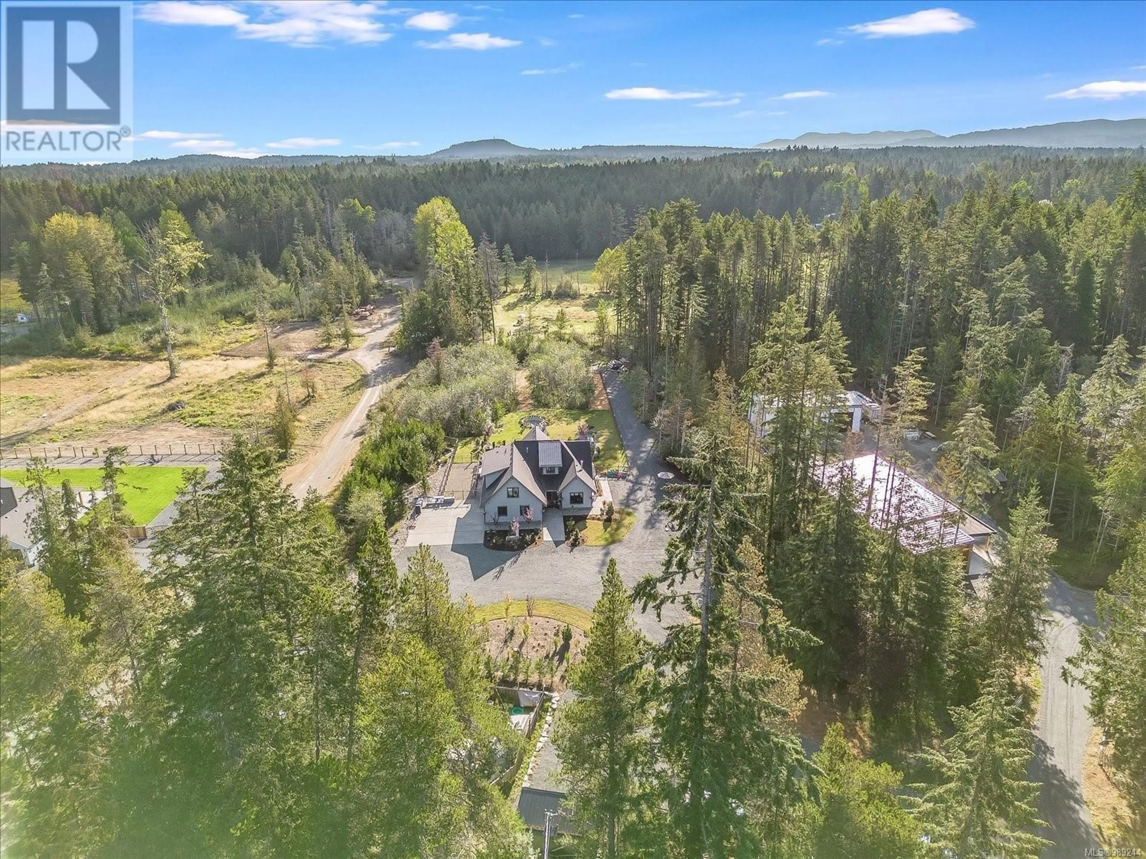 A pic from outside/outdoor area/front of a property/back of a property/a pic from drone, forest/trees view for 1248 Station Rd, Coombs British Columbia V0R1M0