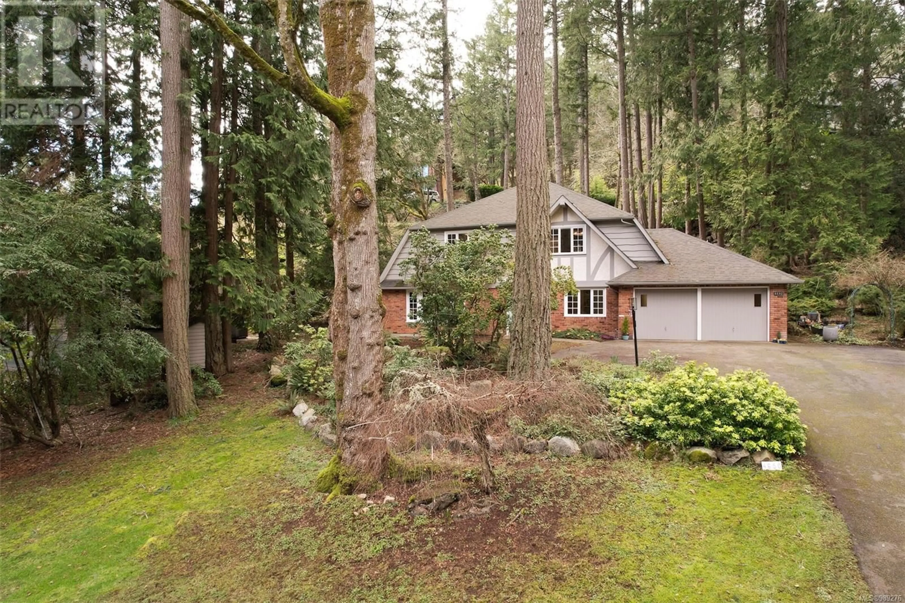 A pic from outside/outdoor area/front of a property/back of a property/a pic from drone, forest/trees view for 4650 Amblewood Dr, Saanich British Columbia V8Y1B9