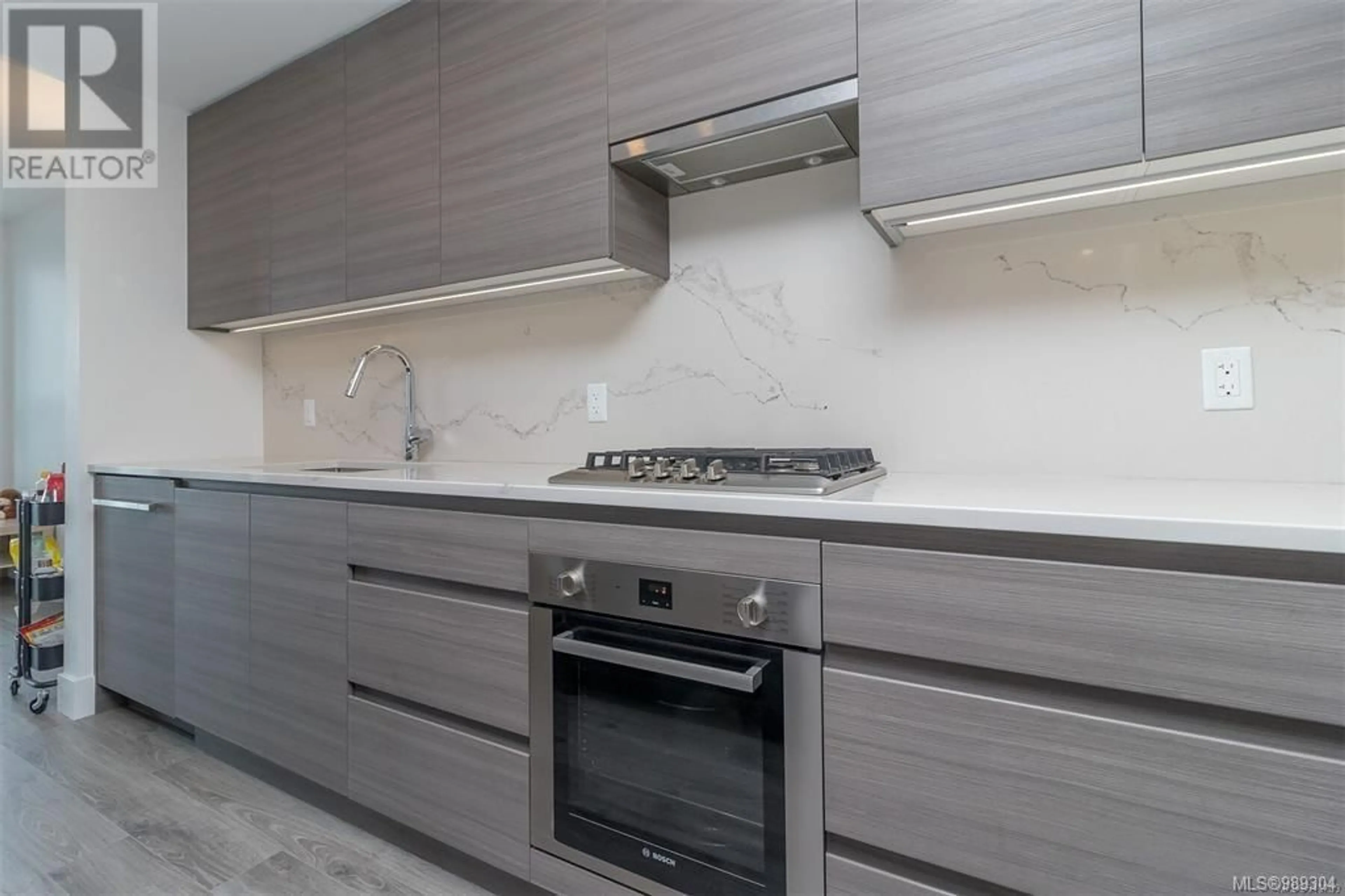 Standard kitchen, wood/laminate floor for 1504 777 Herald St, Victoria British Columbia V8T0C7