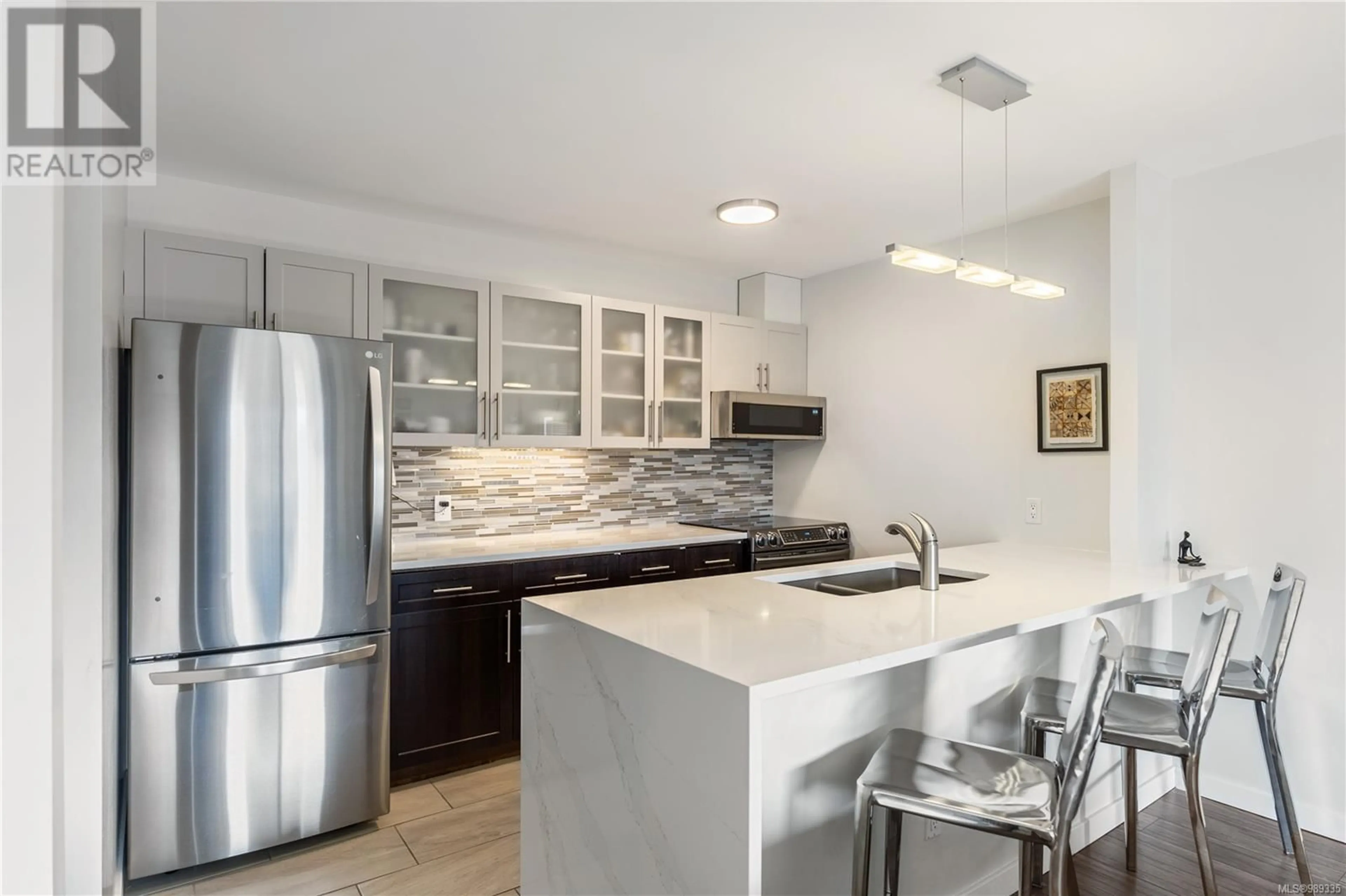 Open concept kitchen, ceramic/tile floor for 504 770 Cormorant St, Victoria British Columbia V8W3J3