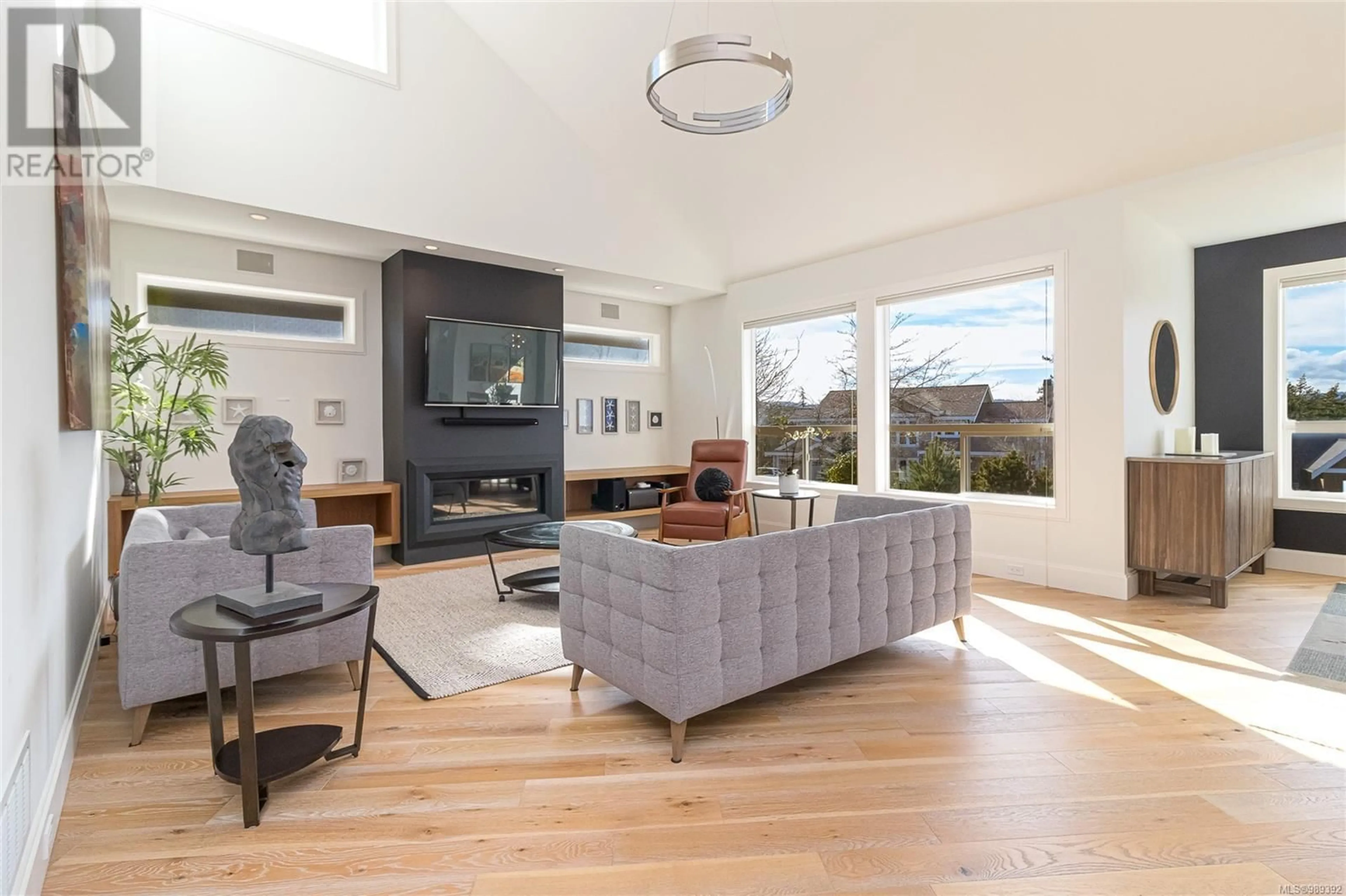 Living room with furniture, wood/laminate floor for 1299 Eston Pl, Langford British Columbia V9B6V3