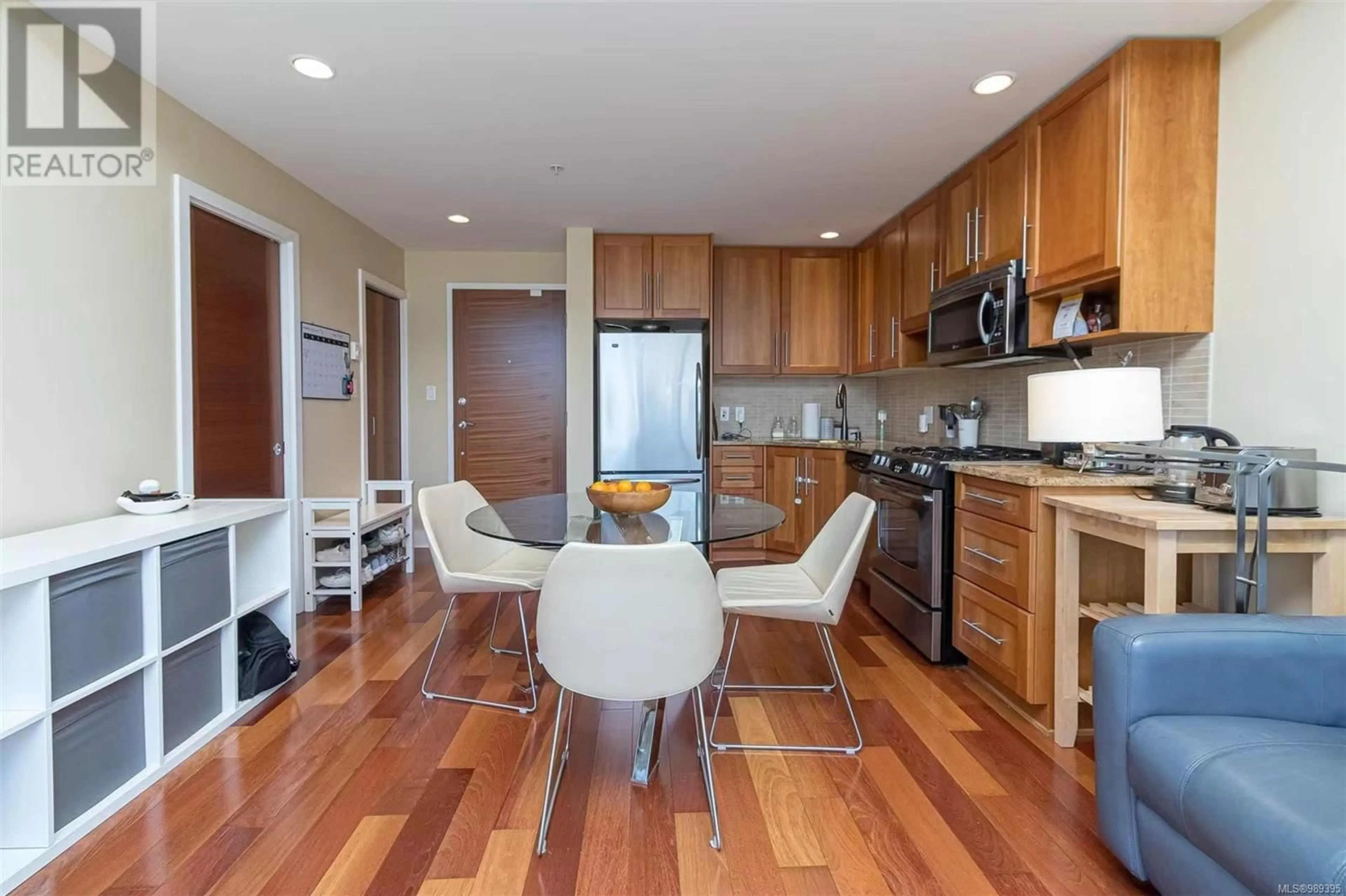 Open concept kitchen, wood/laminate floor for 703 828 Rupert Terr, Victoria British Columbia V8W0A7