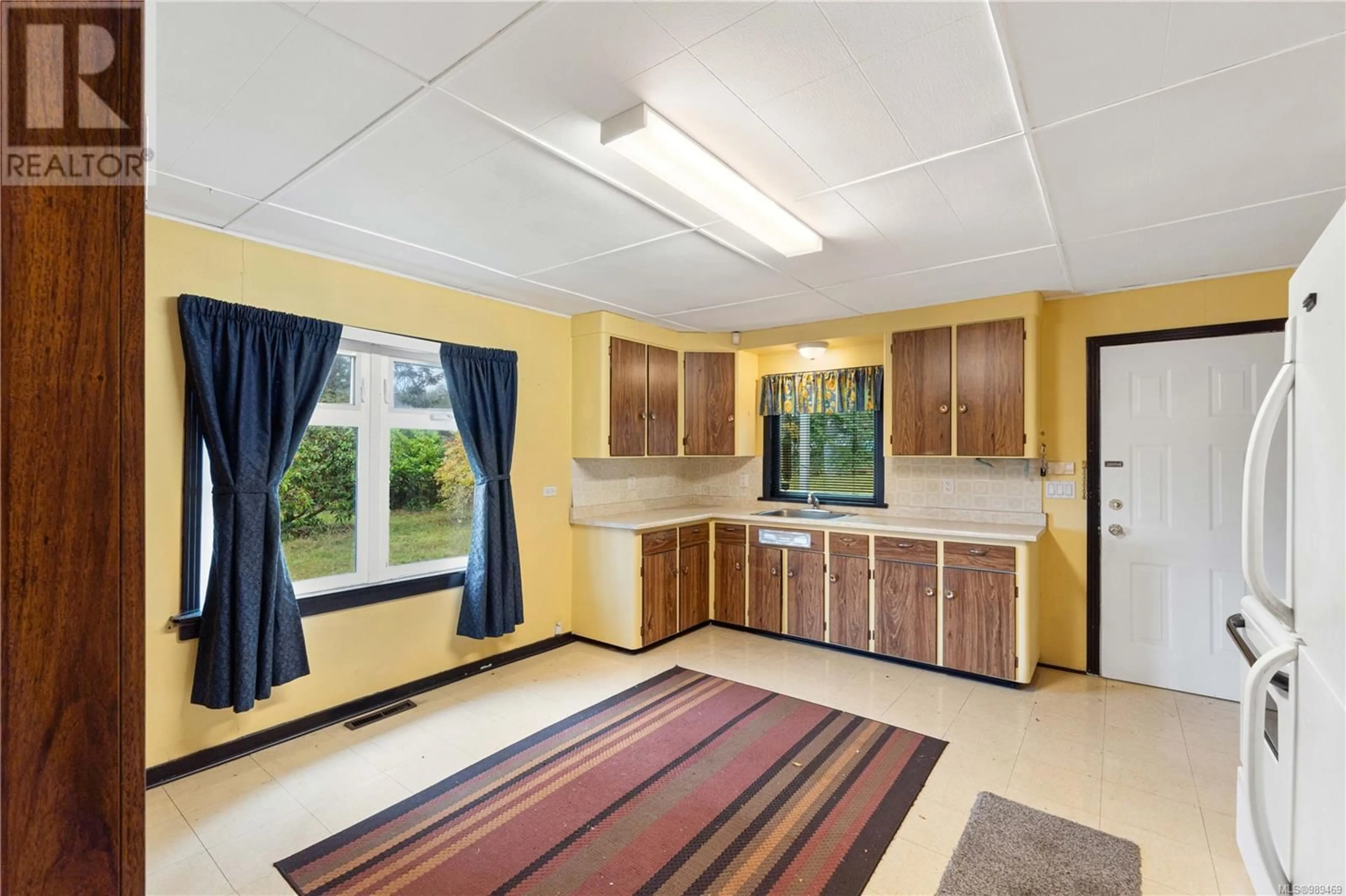 Standard kitchen, ceramic/tile floor for 6850 Island Hwy W, Bowser British Columbia V0R1G0