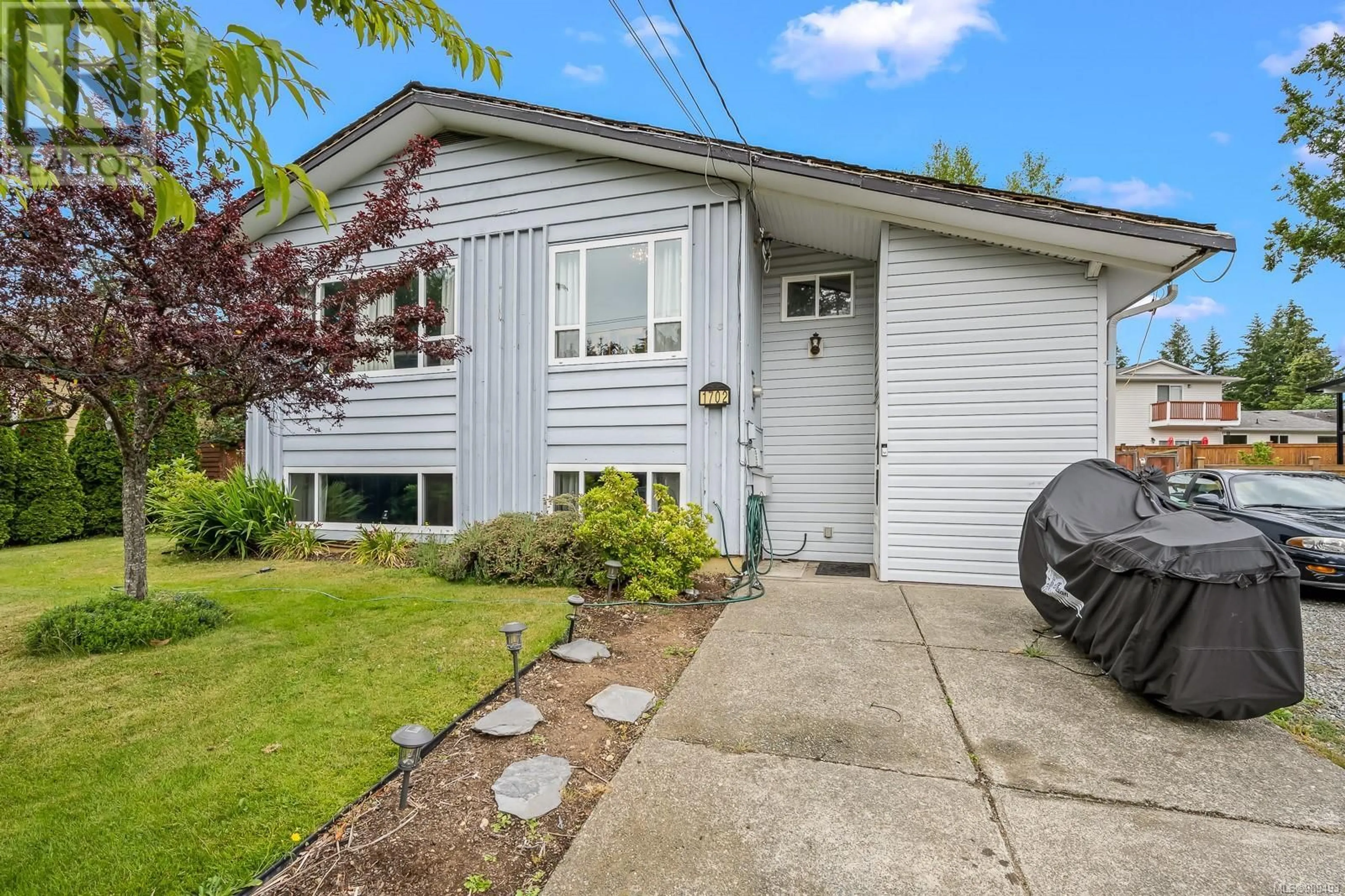 Home with vinyl exterior material, street for 1702 Noel Ave, Comox British Columbia V9M2L7