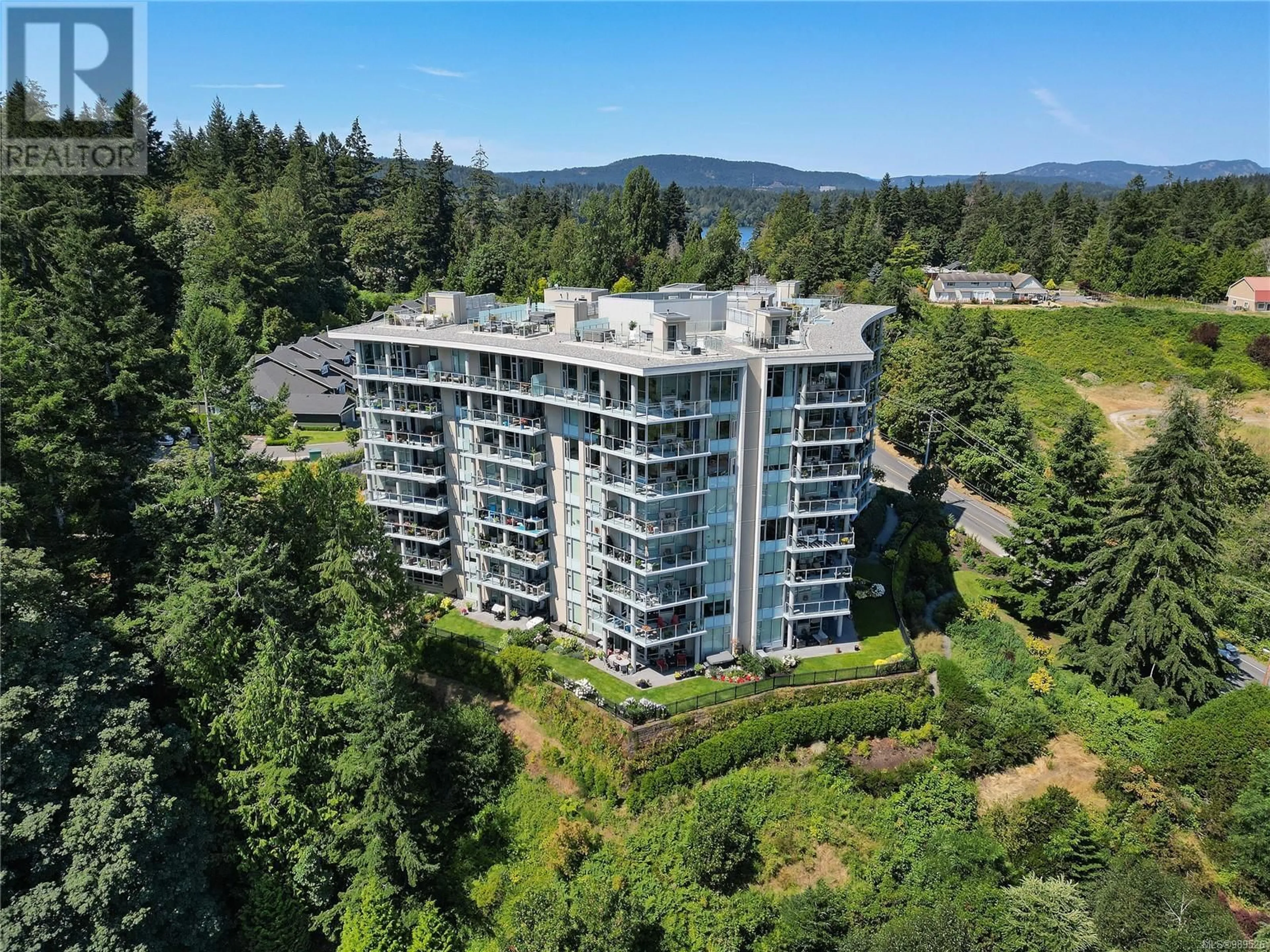 A pic from outside/outdoor area/front of a property/back of a property/a pic from drone, water/lake/river/ocean view for 403 5388 Hill Rise Terr, Saanich British Columbia V8Y3K3