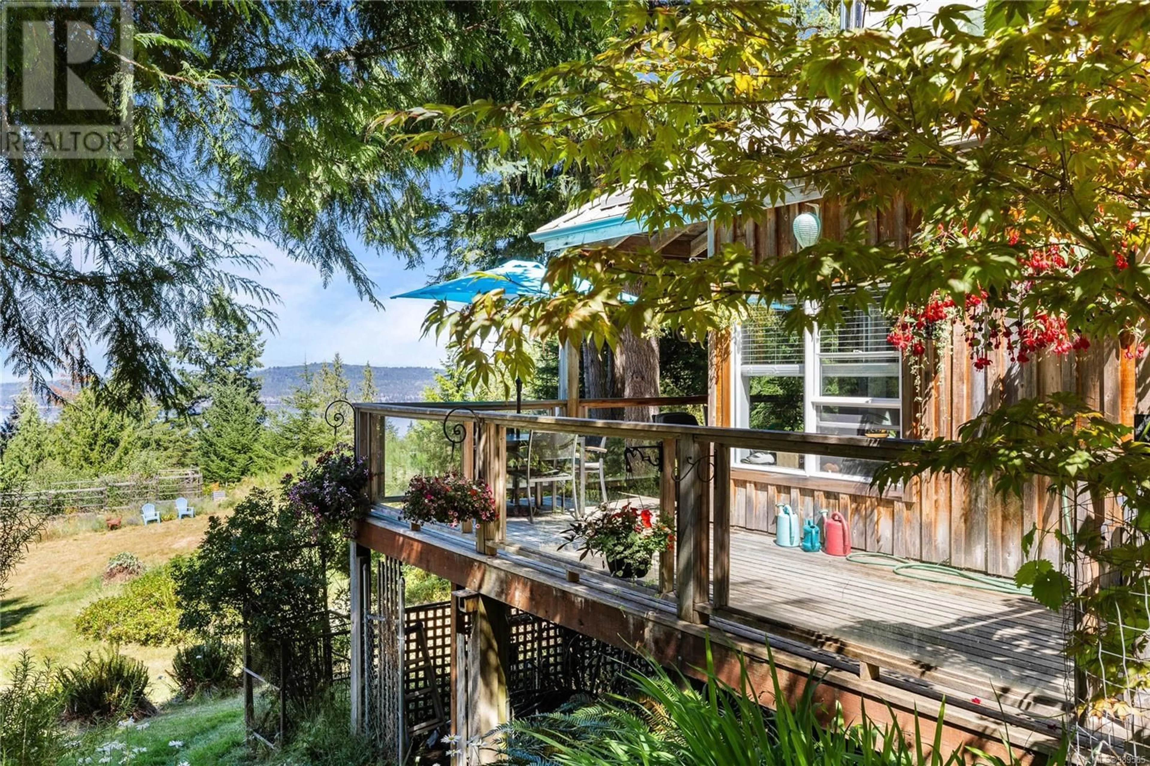 A pic from outside/outdoor area/front of a property/back of a property/a pic from drone, water/lake/river/ocean view for 336 Trincomali Hts, Salt Spring British Columbia V8K1M9