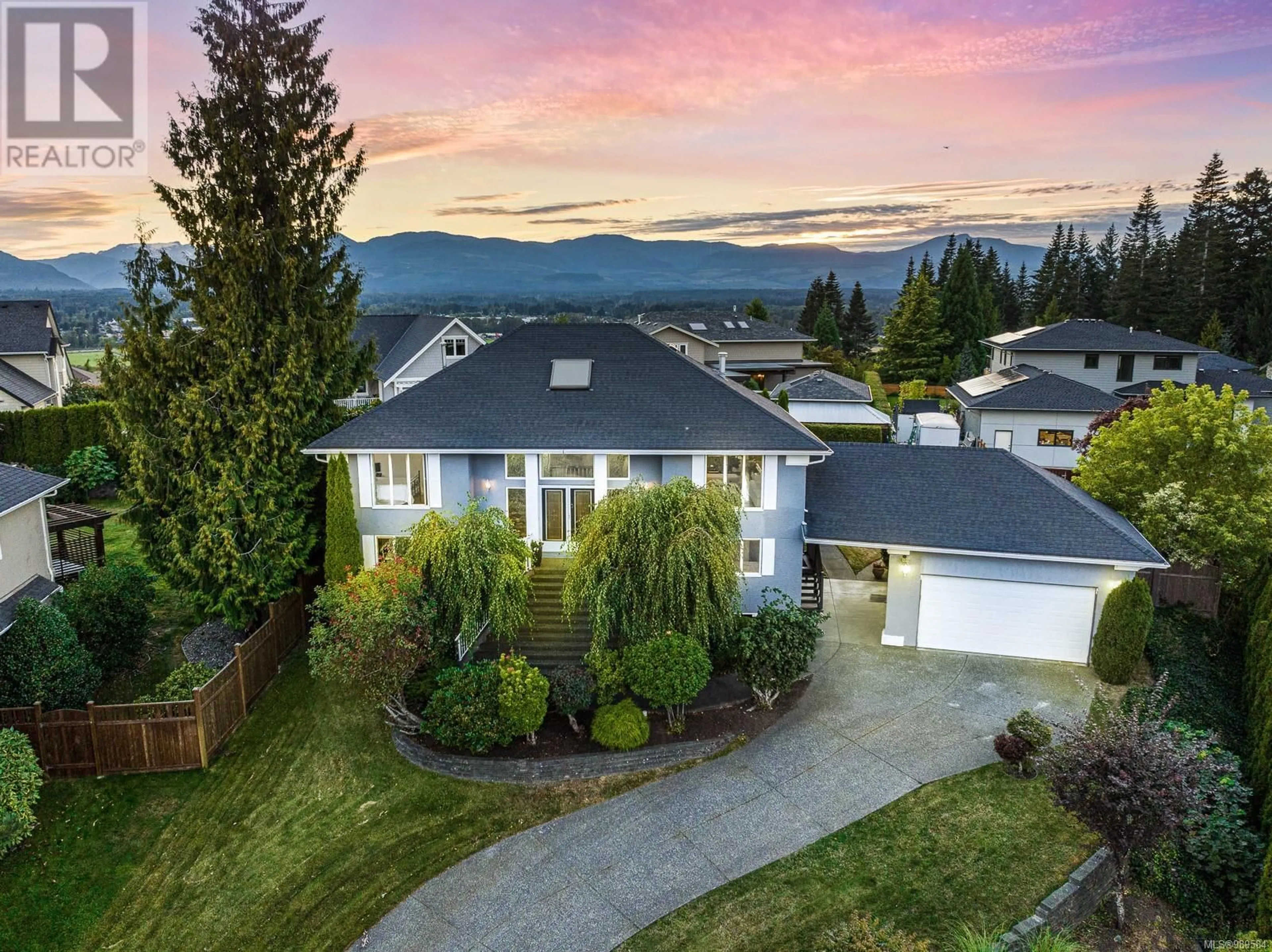 A pic from outside/outdoor area/front of a property/back of a property/a pic from drone, mountain view for 1697 Swan Cres, Courtenay British Columbia V9N9A7