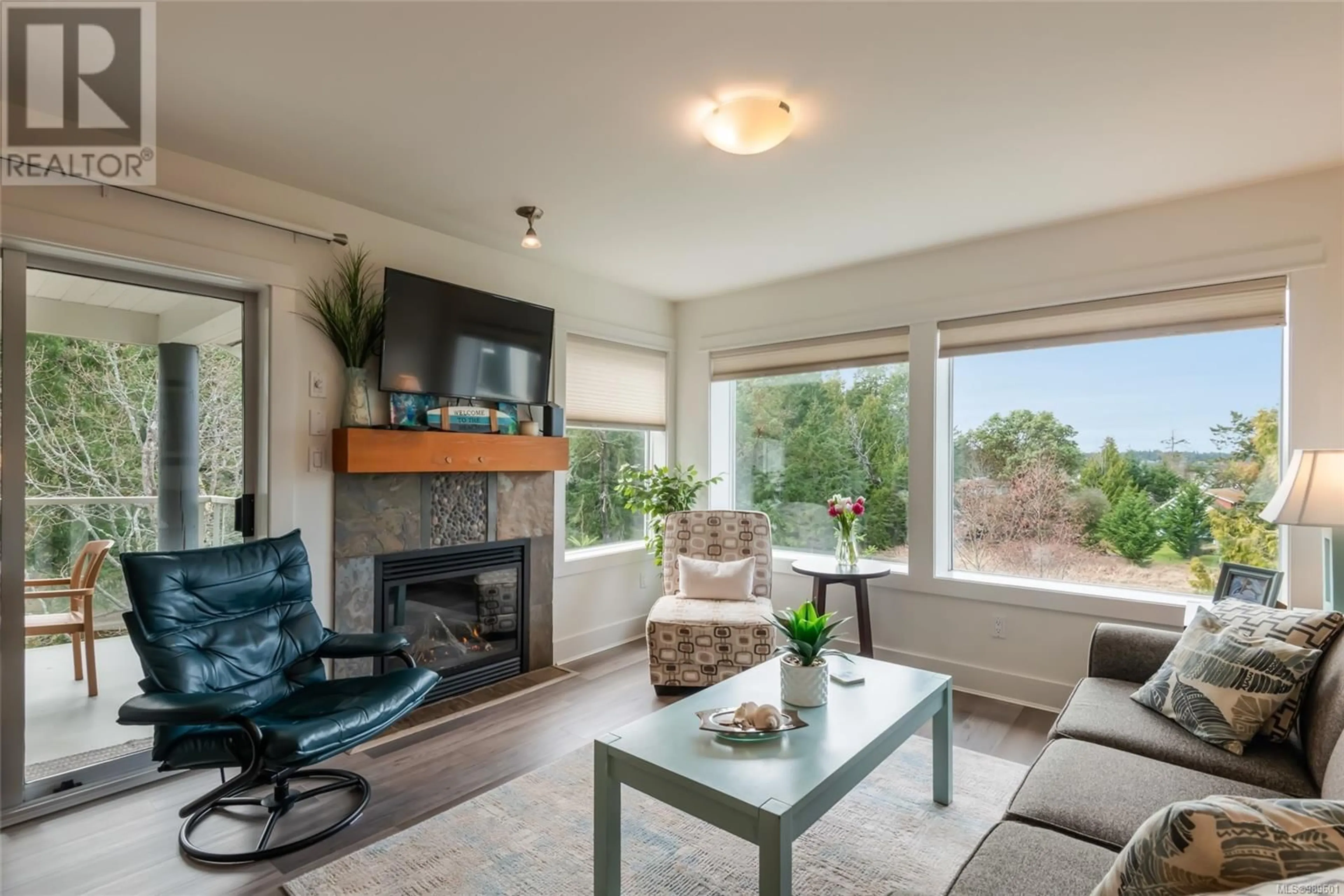 Living room with furniture, wood/laminate floor for 241 1600 Stroulger Rd, Nanoose Bay British Columbia V9P9B7