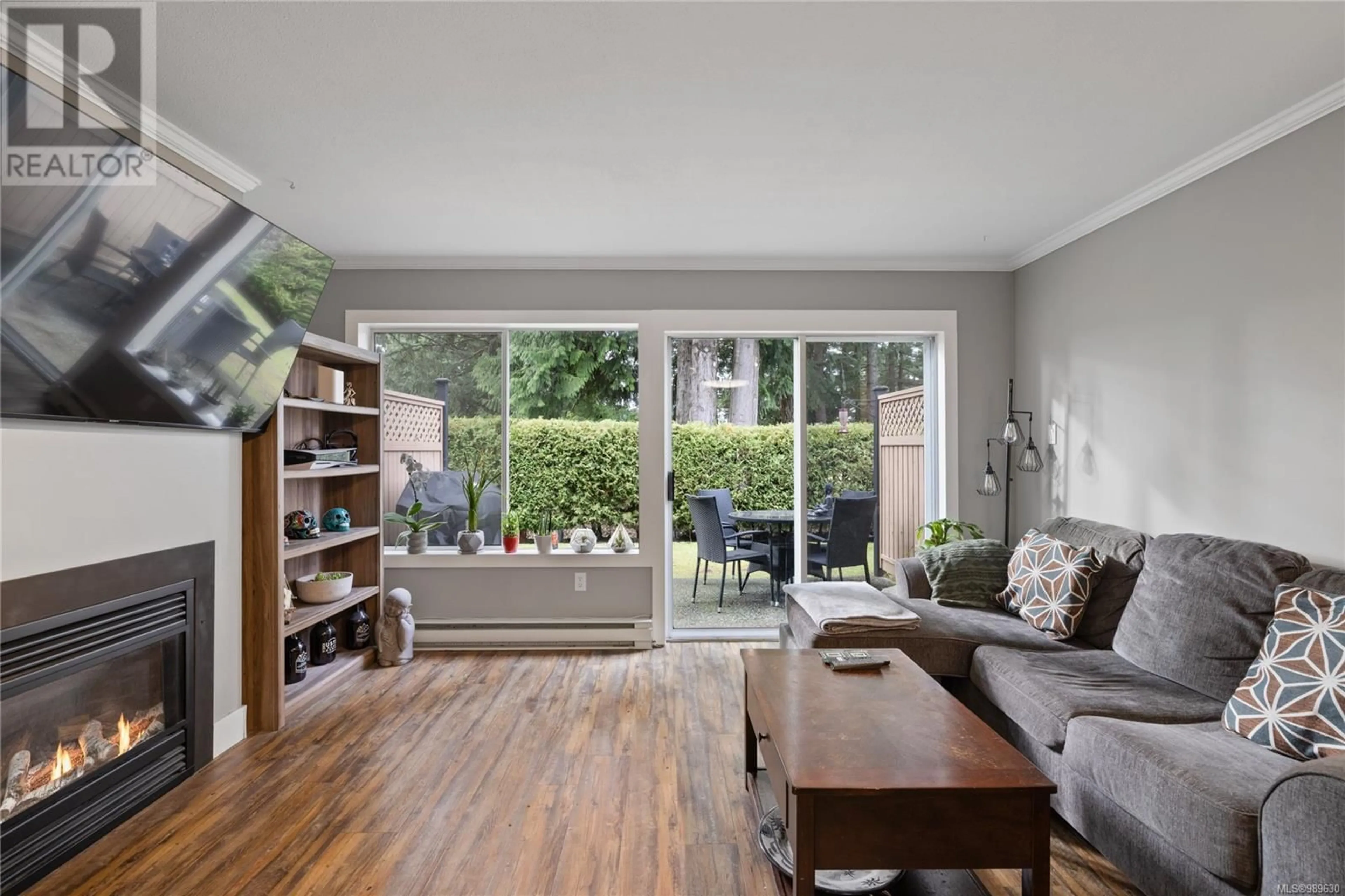 Living room with furniture, wood/laminate floor for 6055 Pleasant Valley Way, Nanaimo British Columbia V9T6E7