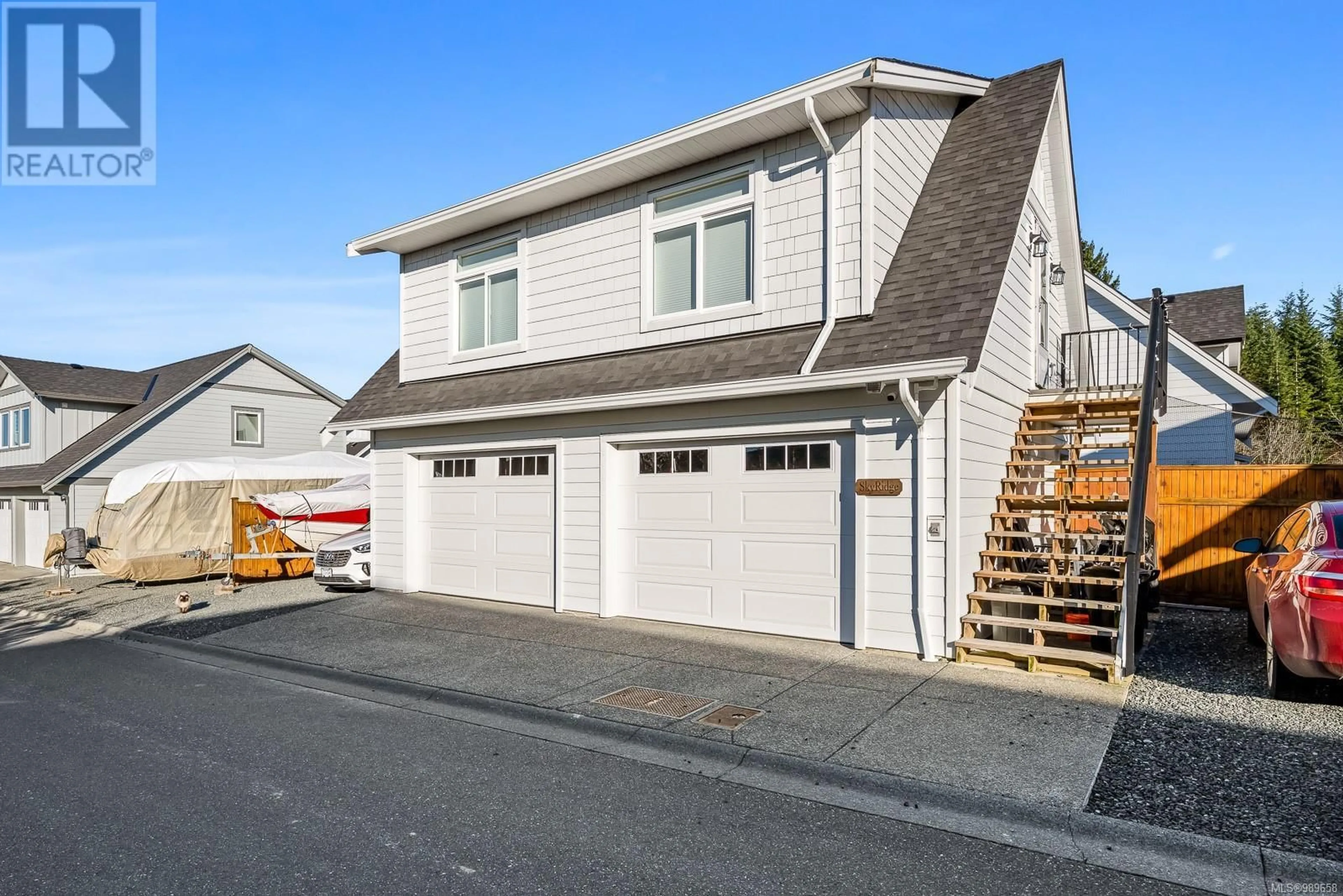 Home with vinyl exterior material, street for 4017 Buckstone Rd, Courtenay British Columbia V9N0B4