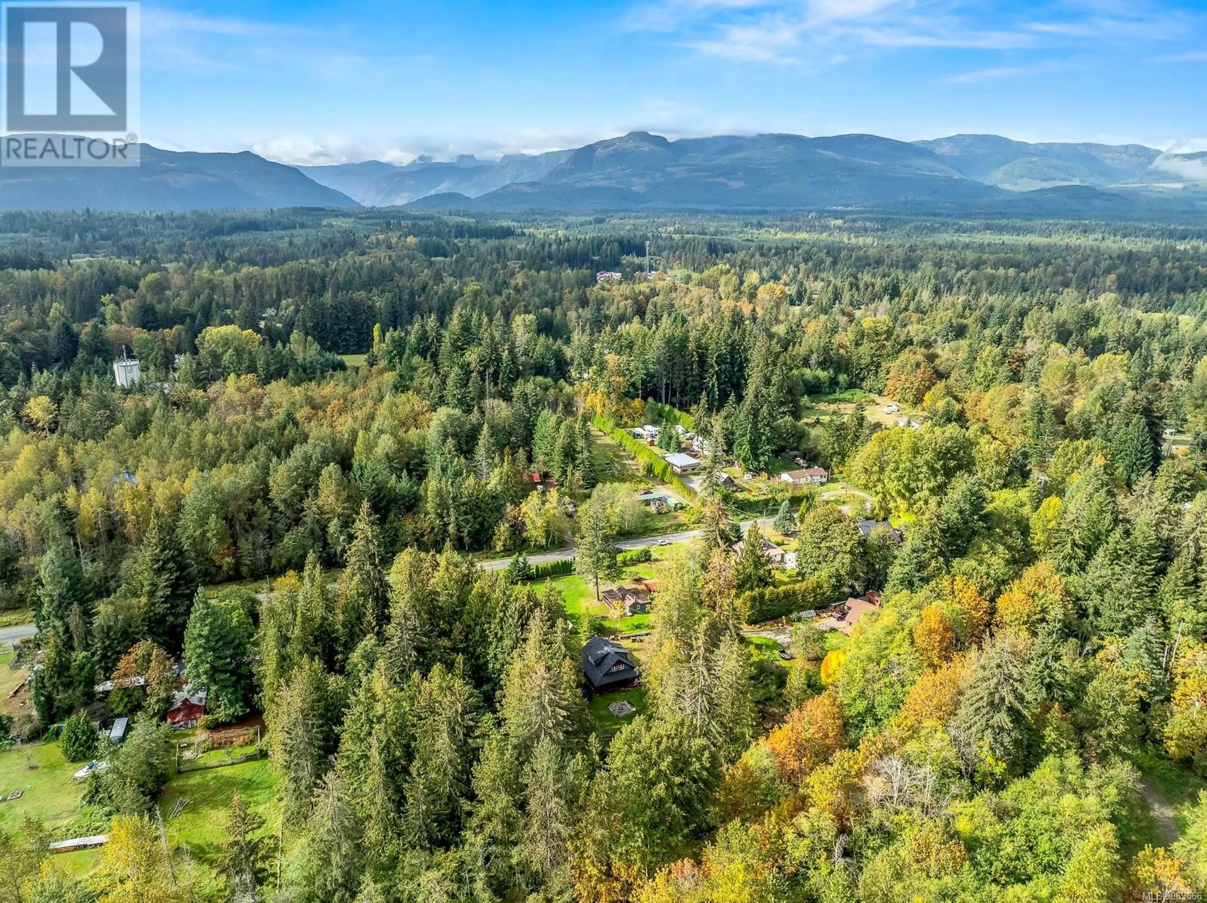 A pic from outside/outdoor area/front of a property/back of a property/a pic from drone, mountain view for 4390/4386 Marsden Rd, Courtenay British Columbia V9N9M4