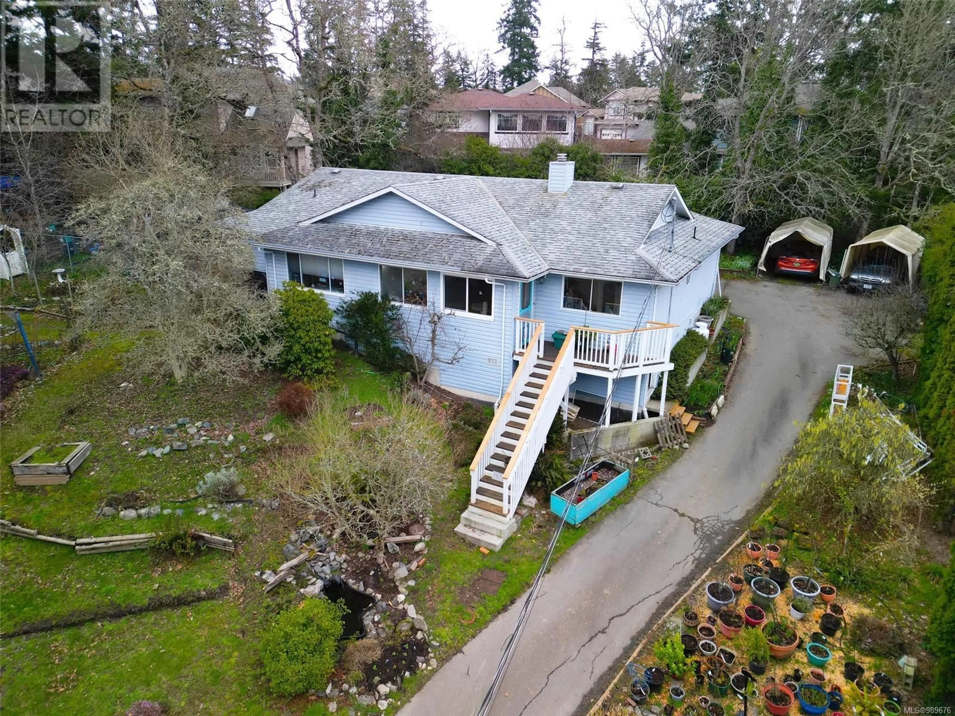 A pic from outside/outdoor area/front of a property/back of a property/a pic from drone, street for 4607 WEST SAANICH ROAD, Saanich British Columbia V8Z3G7