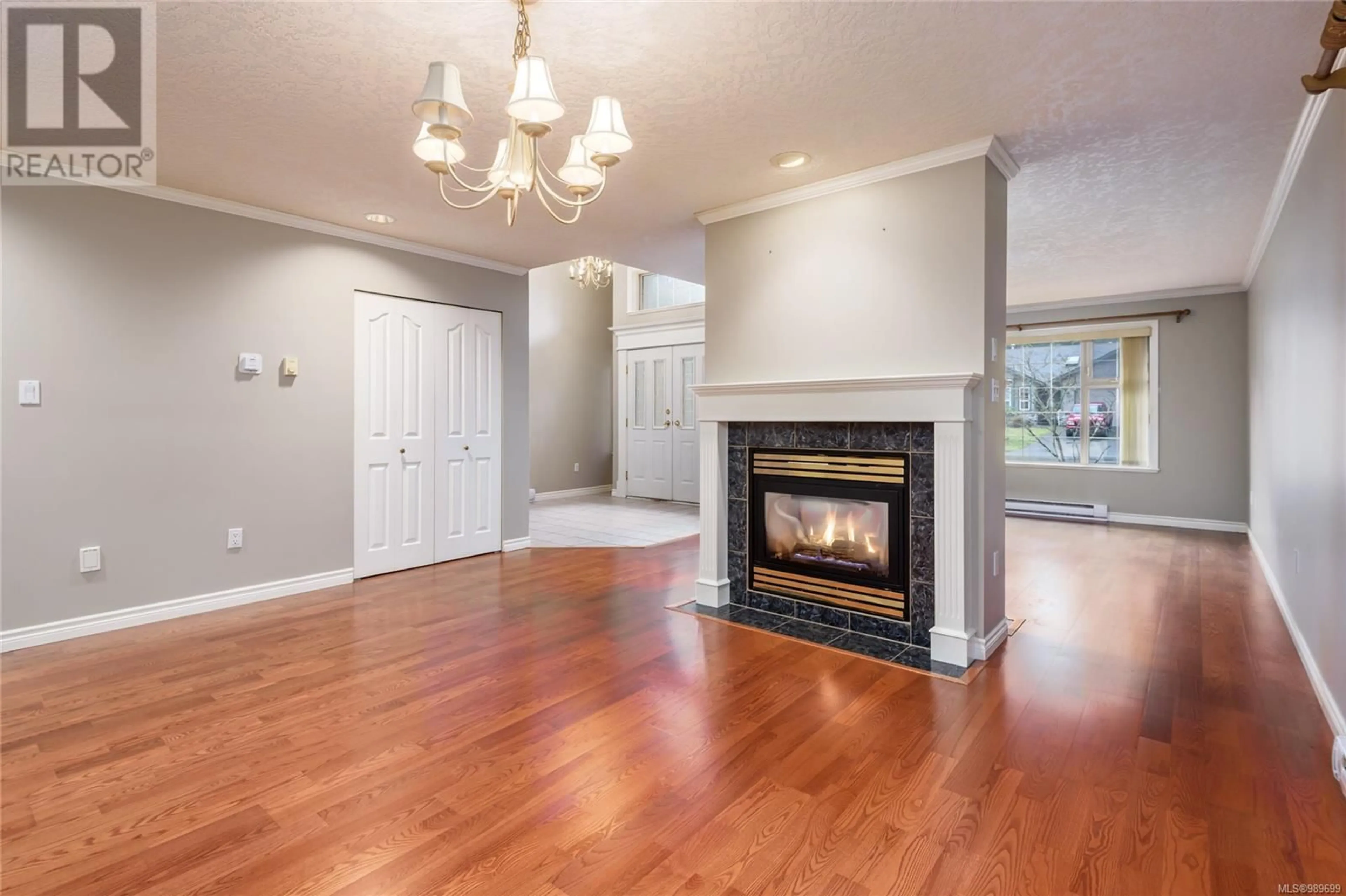 Living room with furniture, wood/laminate floor for 1586 Mulberry Lane, Comox British Columbia V9M3S4