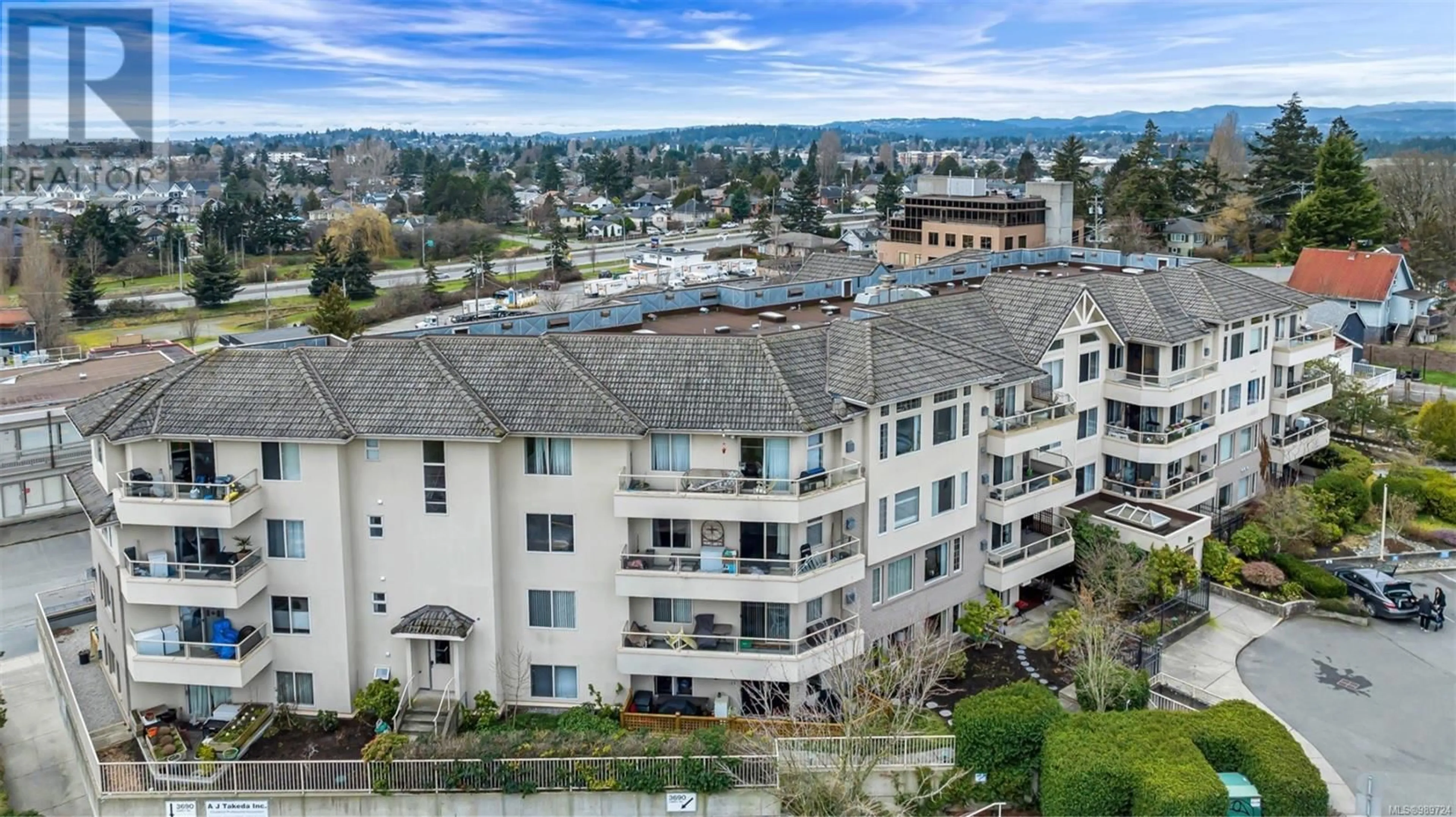 A pic from outside/outdoor area/front of a property/back of a property/a pic from drone, unknown for 401 3700 Carey Rd, Saanich British Columbia V8Z4C2