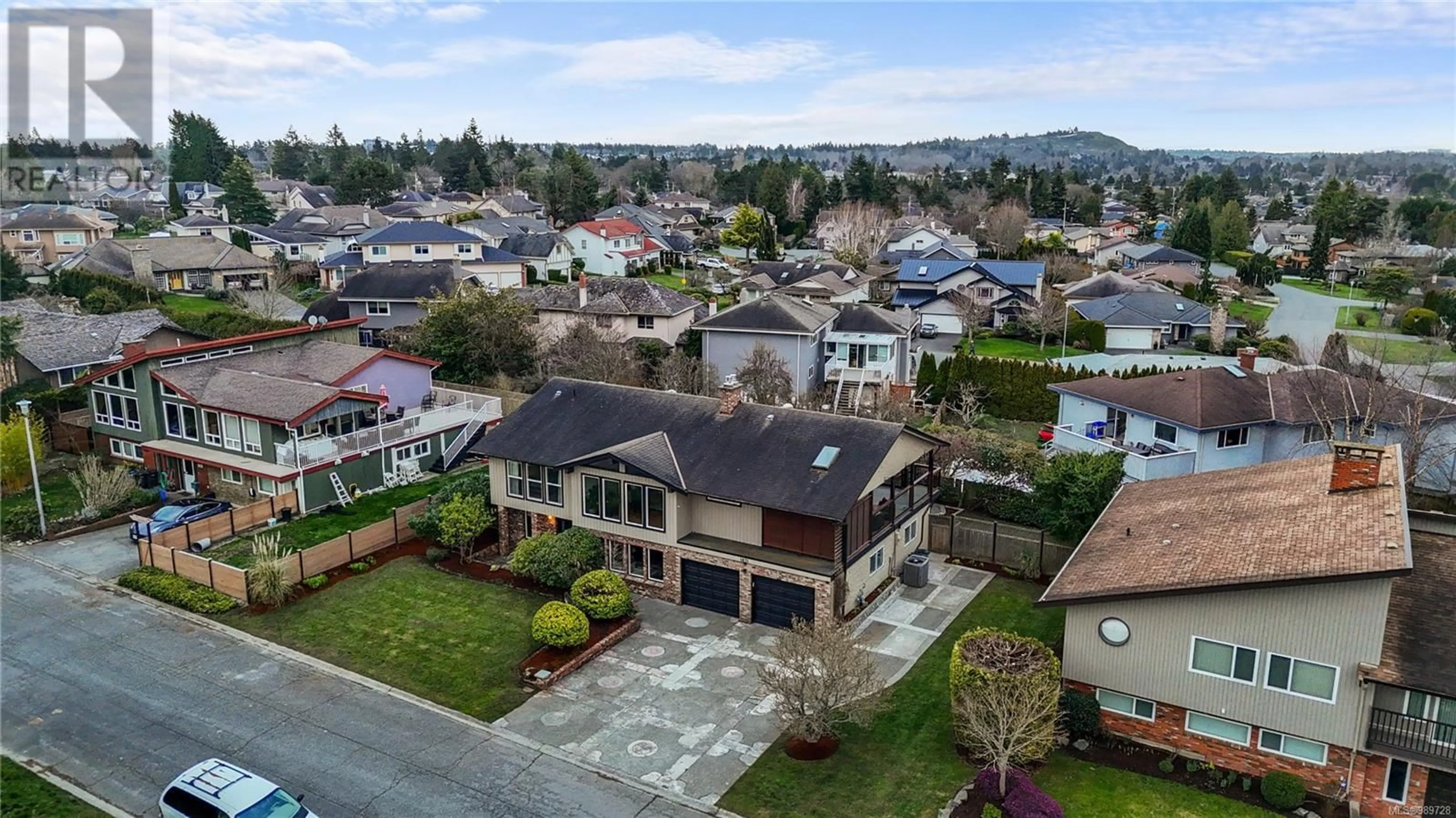 A pic from outside/outdoor area/front of a property/back of a property/a pic from drone, street for 1831 Merida Pl, Saanich British Columbia V8N5E1