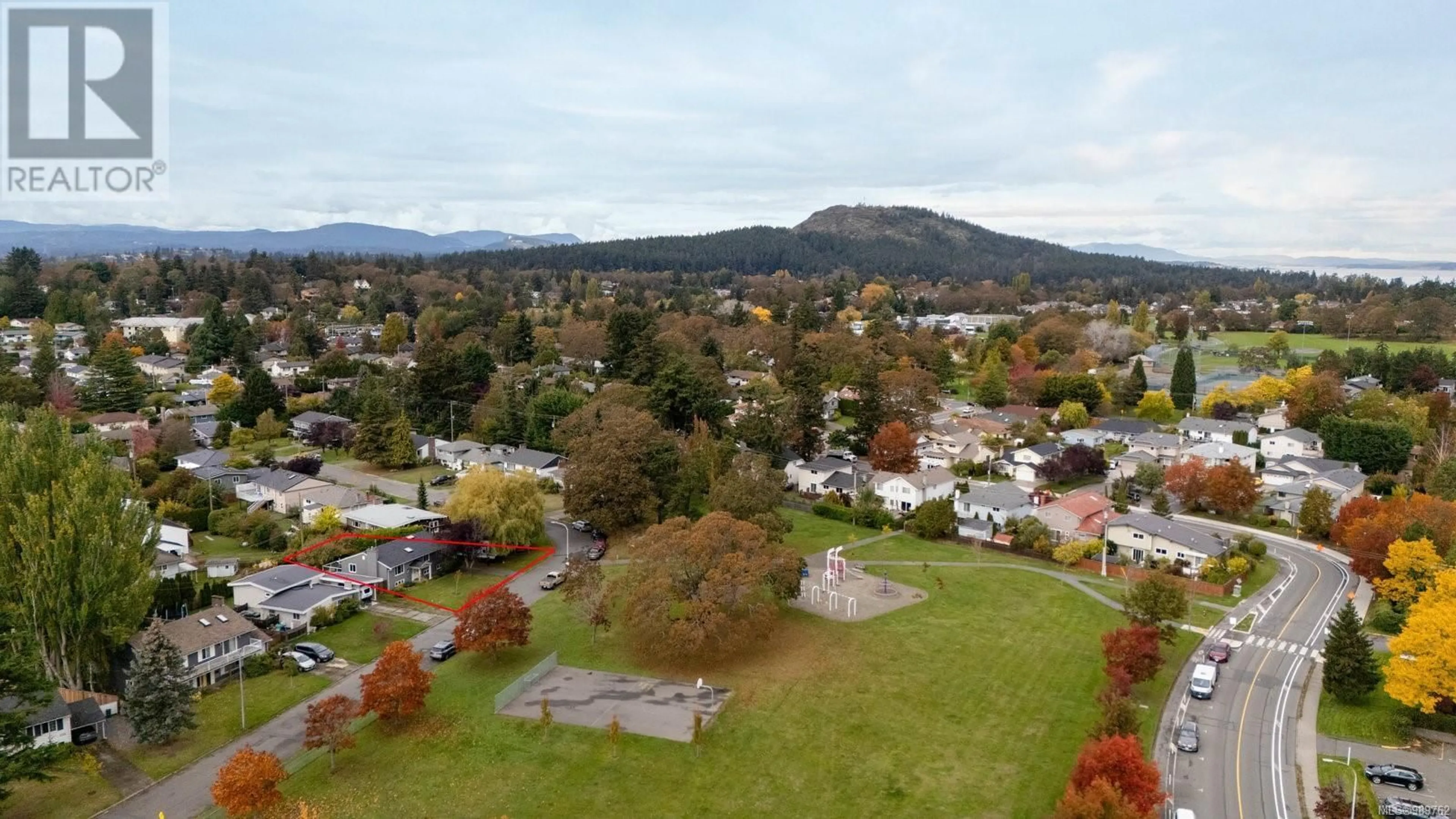 A pic from outside/outdoor area/front of a property/back of a property/a pic from drone, mountain view for 1719 CARNEGIE CRESCENT, Saanich British Columbia V8N1P2