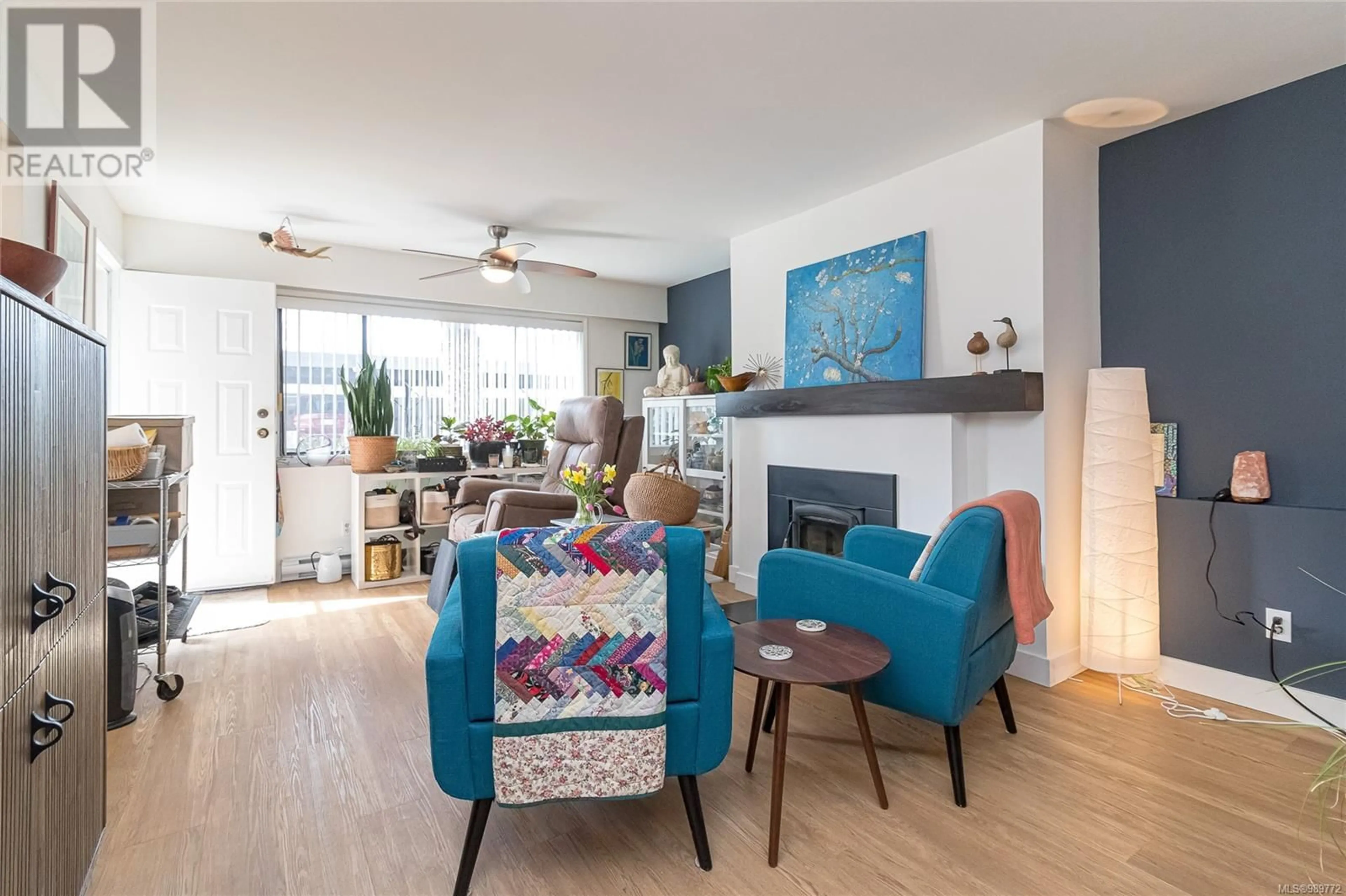 Living room with furniture, wood/laminate floor for 104 2286 Henry Ave, Sidney British Columbia V8L2B2