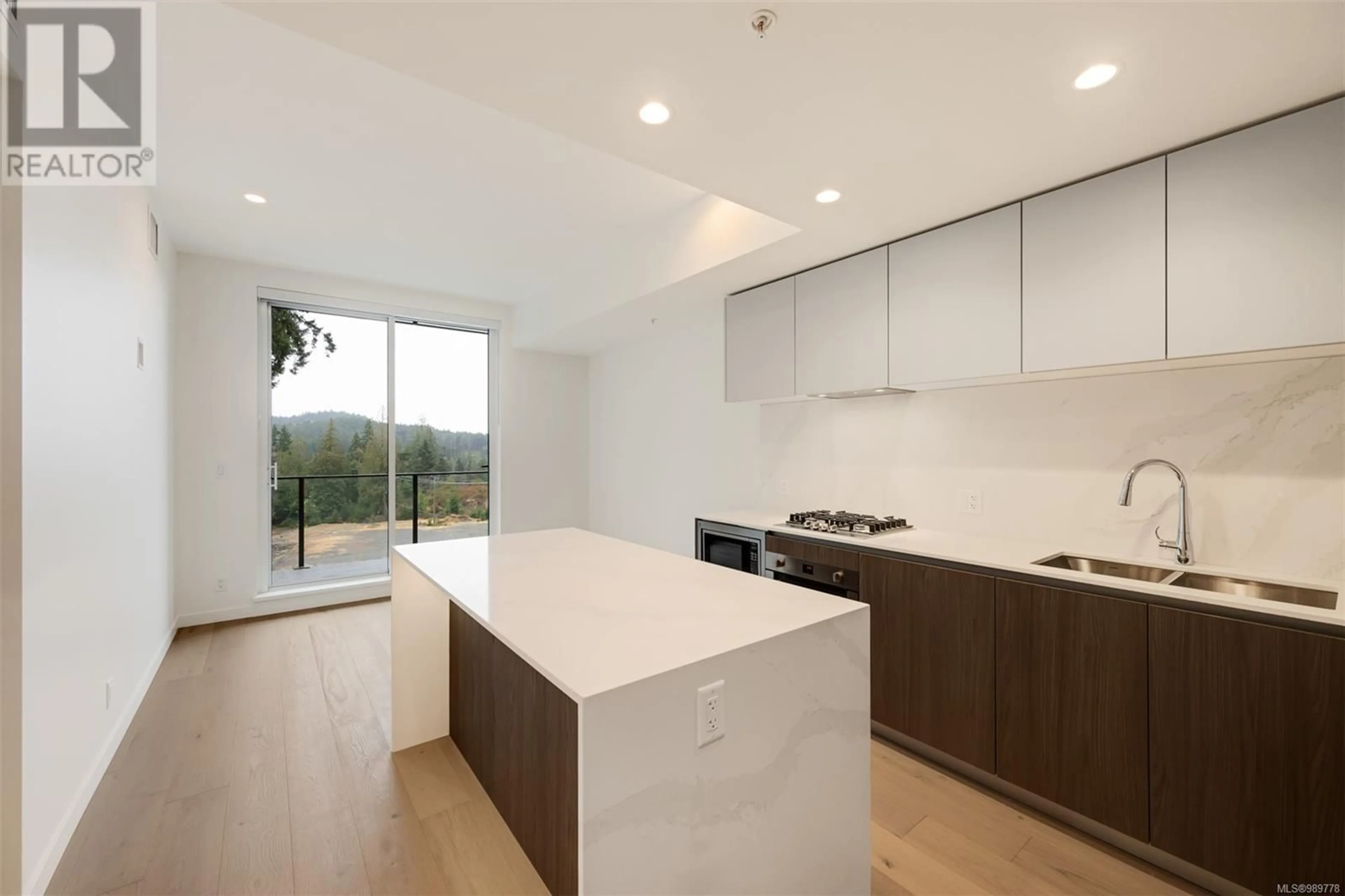 Open concept kitchen, wood/laminate floor for 416 - 2000 HANNINGTON ROAD, Langford British Columbia V9B6R6