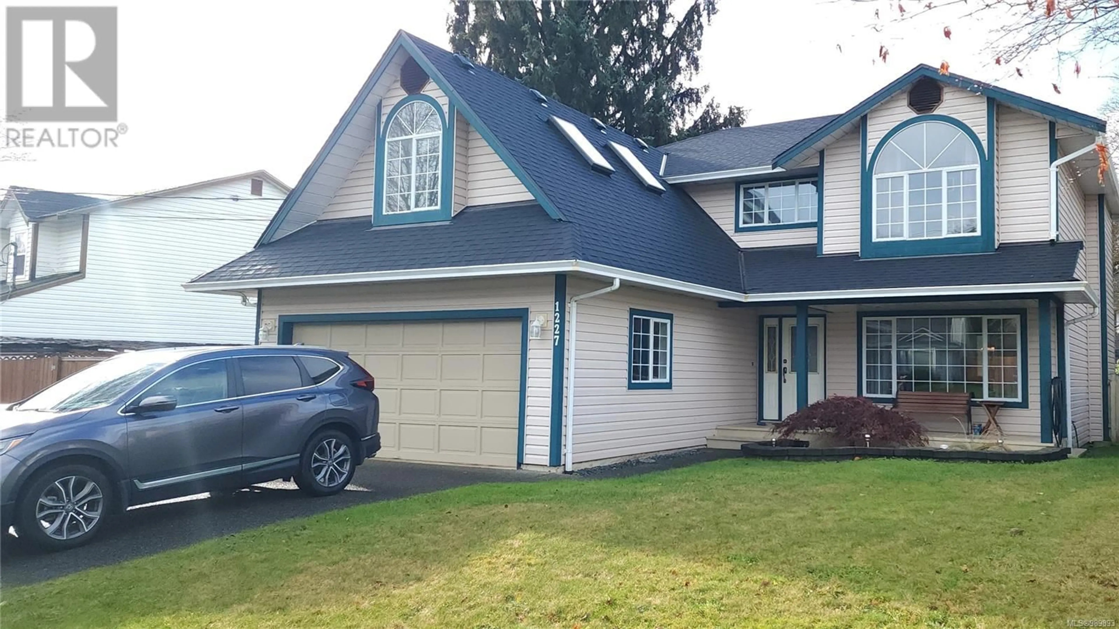 Home with vinyl exterior material, street for 1227 Gazelle Rd, Campbell River British Columbia V9W7J8