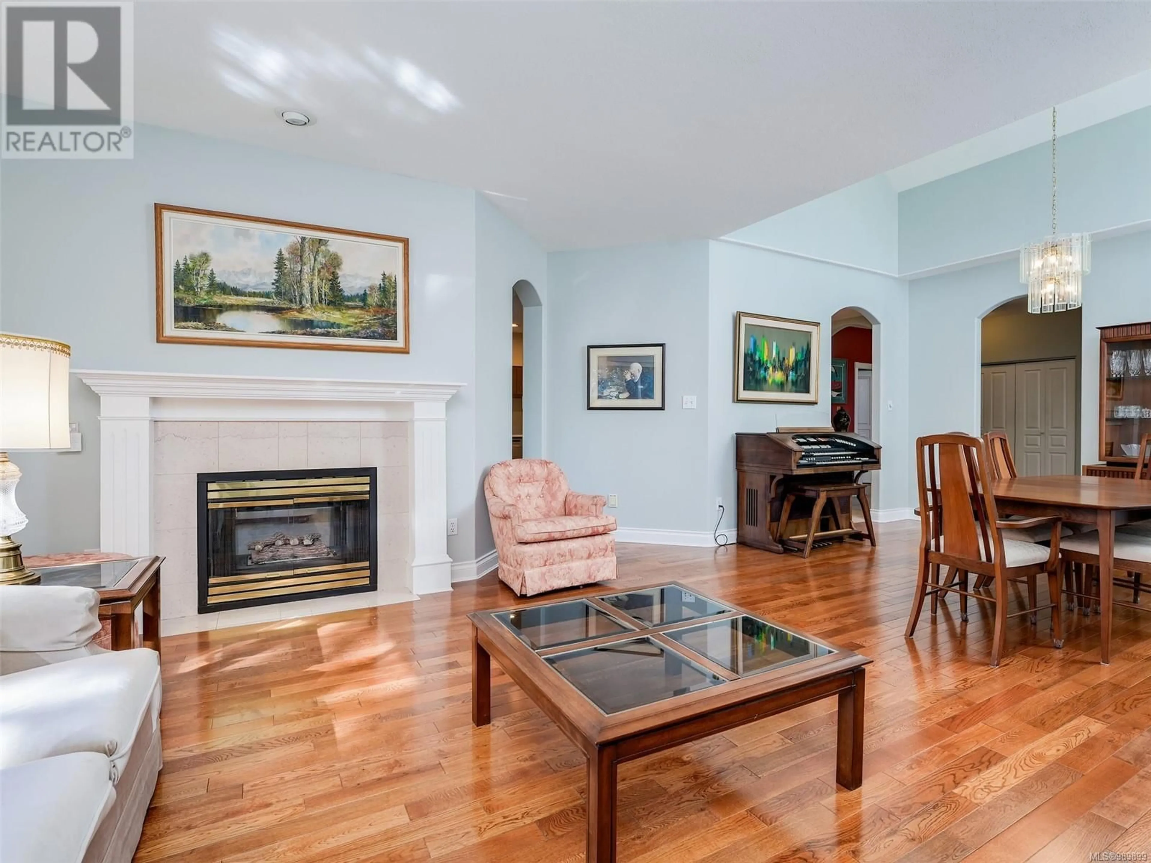 Living room with furniture, wood/laminate floor for 43 530 Marsett Pl, Saanich British Columbia V8Z7J2