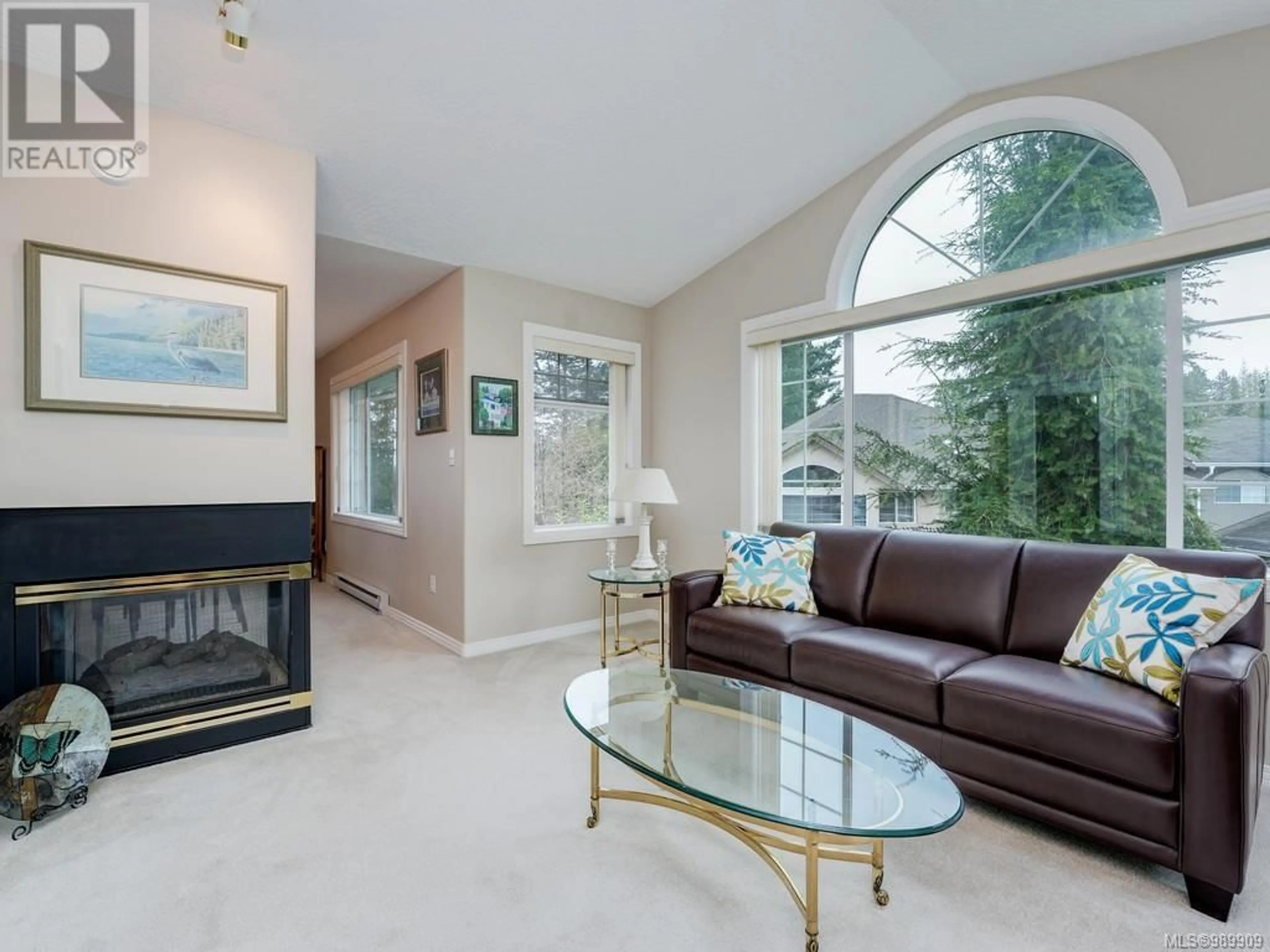 Living room with furniture, ceramic/tile floor for 6255 Springlea Rd, Central Saanich British Columbia V8Z5Z5