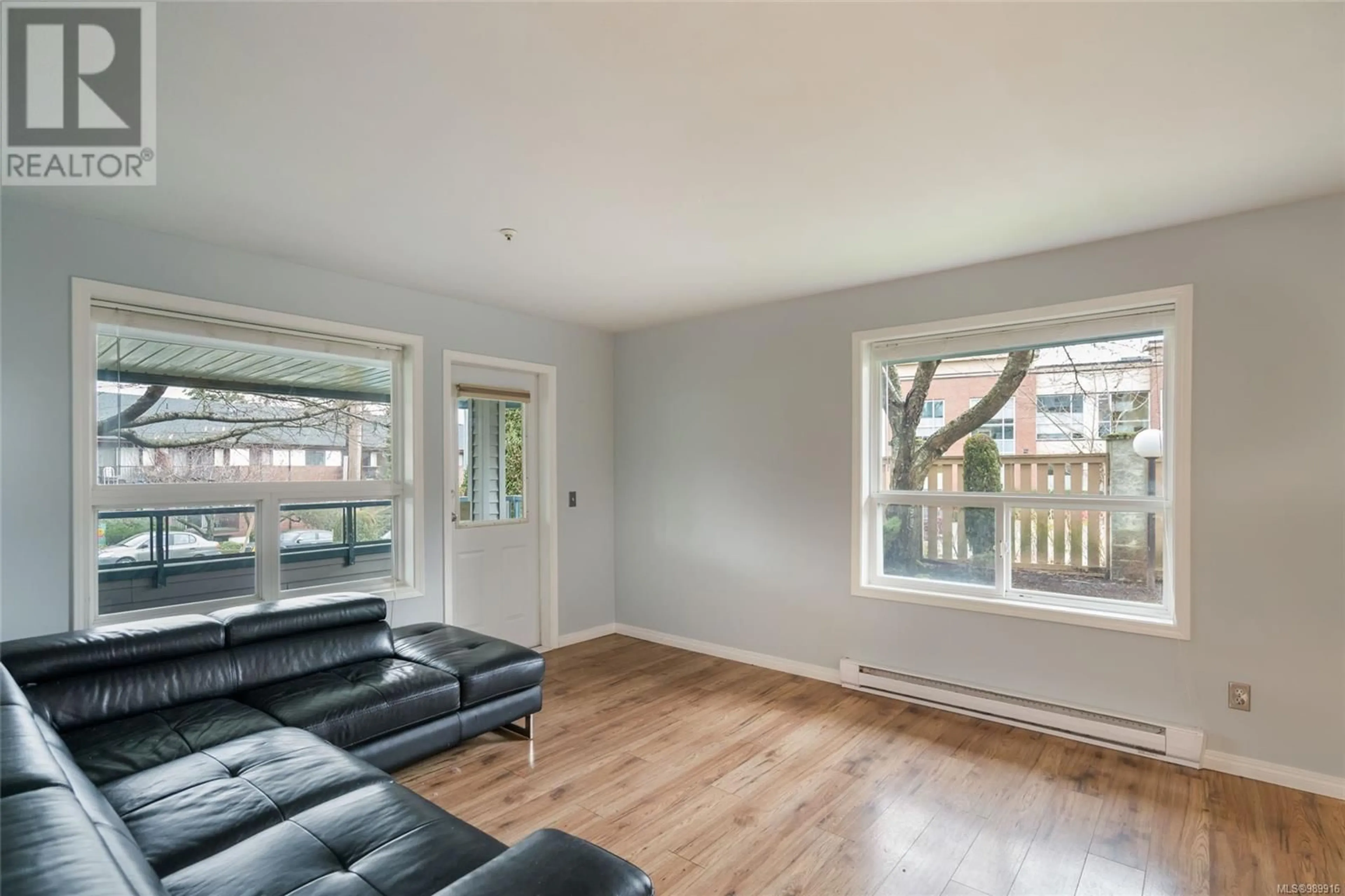 Living room with furniture, wood/laminate floor for 102 1631 Dufferin Cres, Nanaimo British Columbia V9S5T4