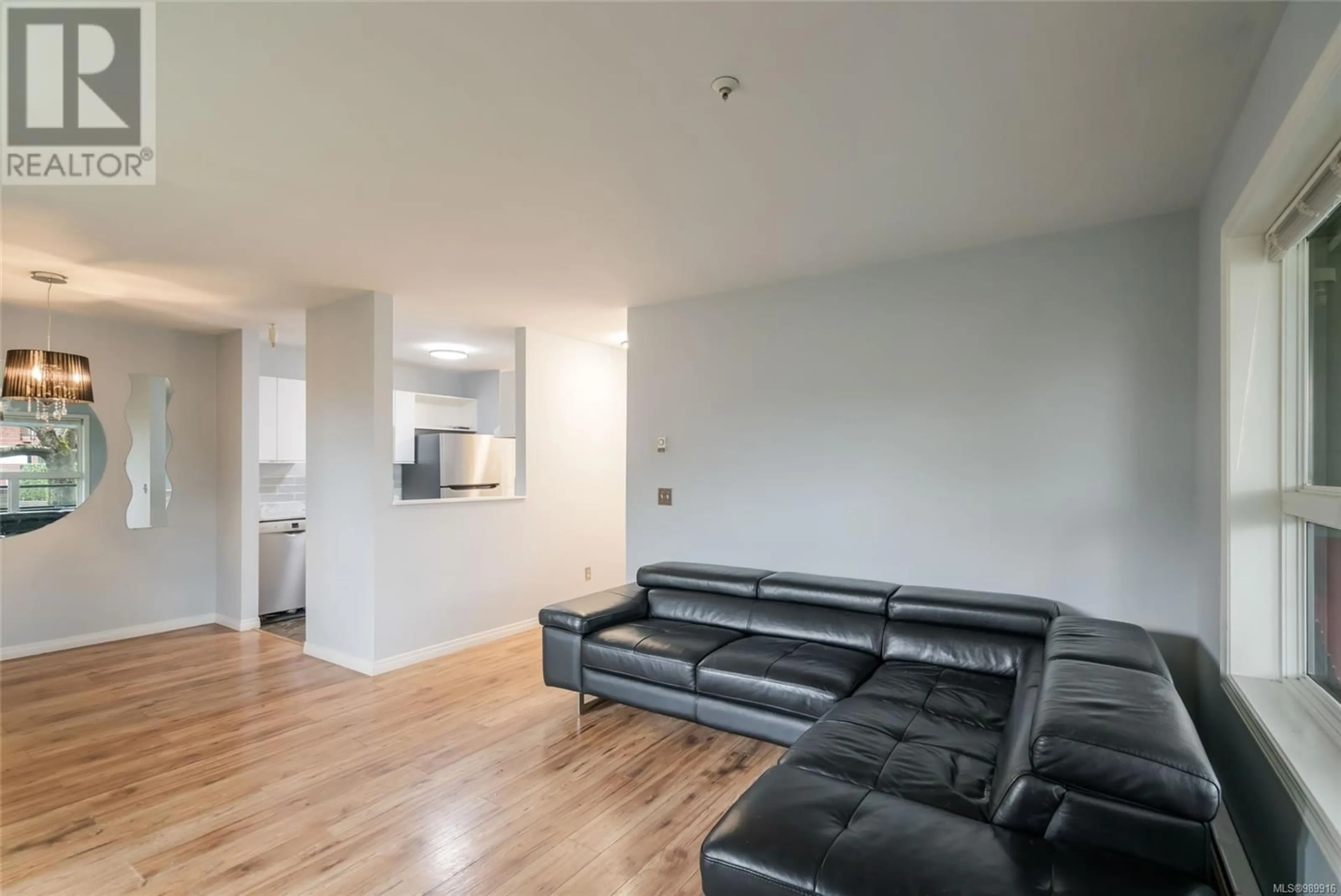 Living room with furniture, wood/laminate floor for 102 1631 Dufferin Cres, Nanaimo British Columbia V9S5T4