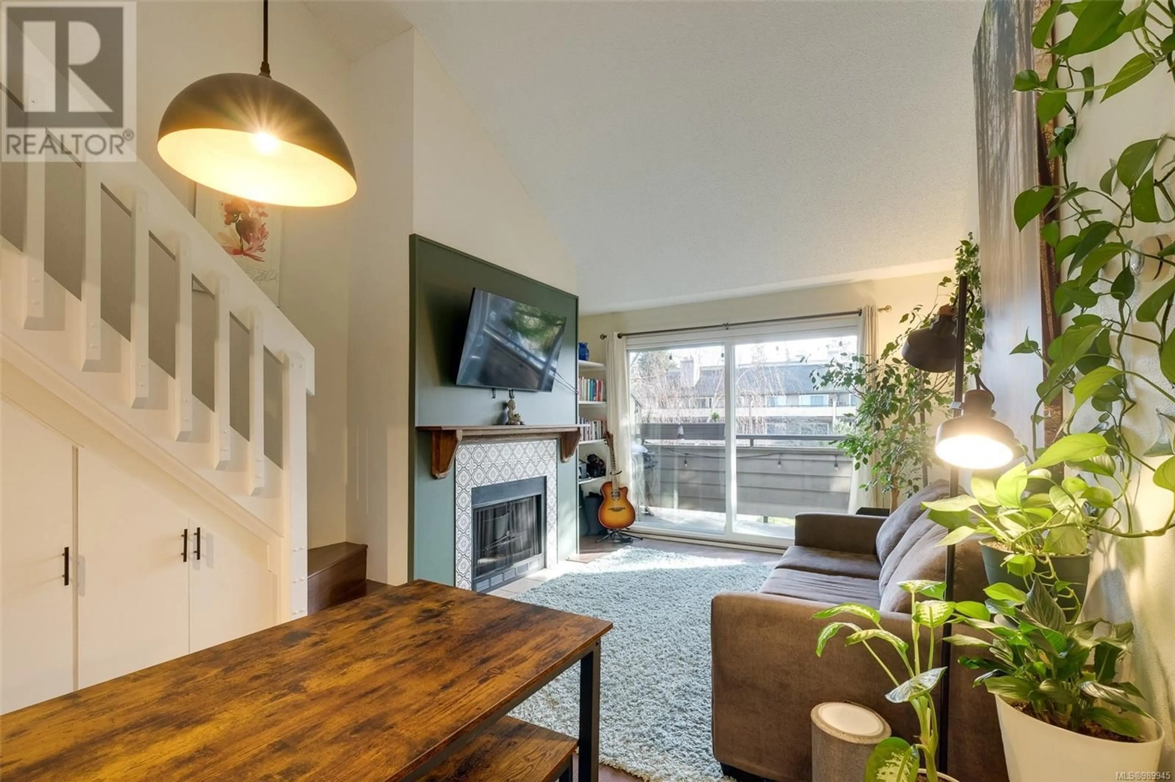 Living room with furniture, wood/laminate floor for 311 3215 Alder St, Saanich British Columbia V8X1P3