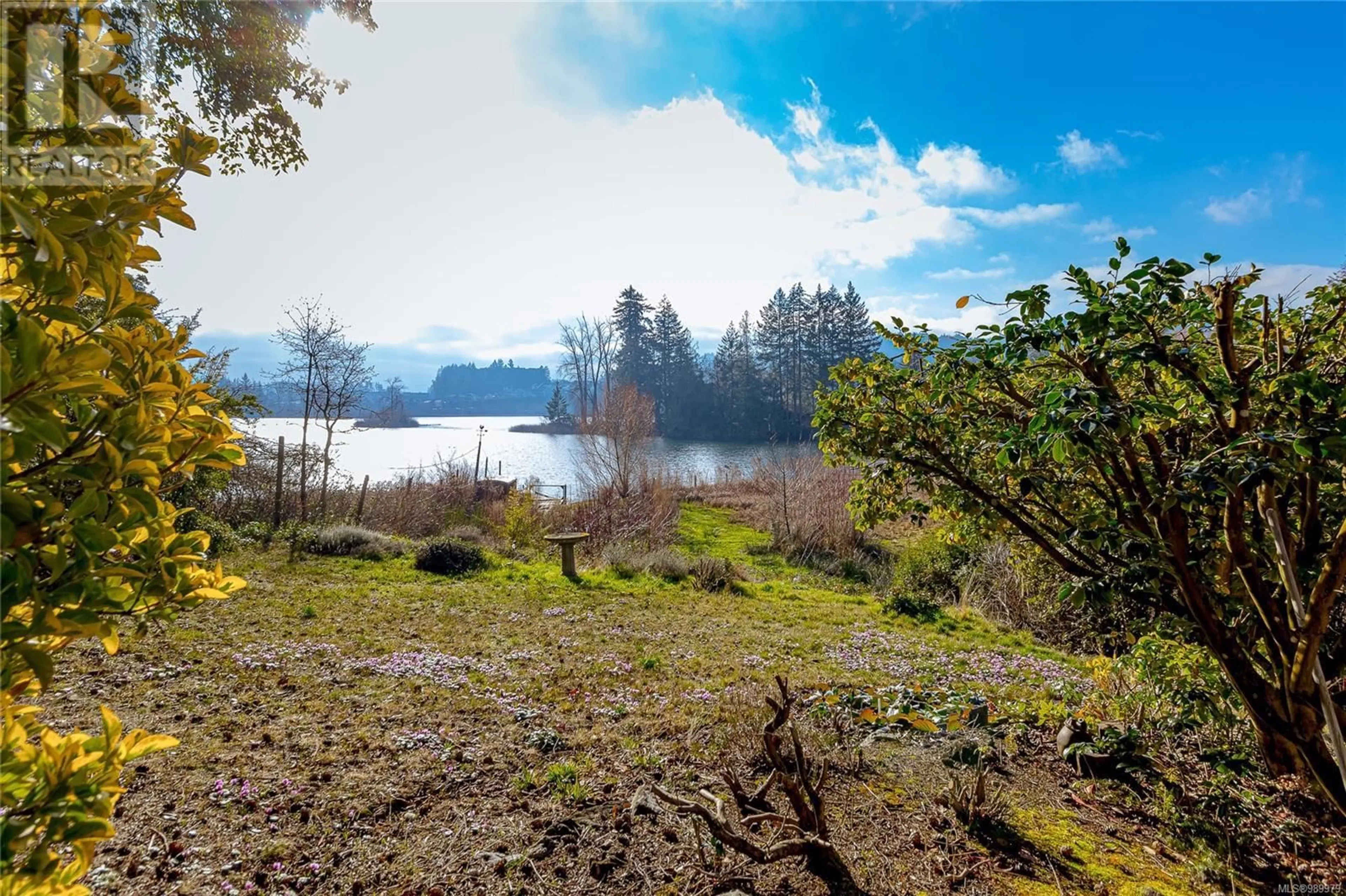 A pic from outside/outdoor area/front of a property/back of a property/a pic from drone, water/lake/river/ocean view for 1247 Goldstream Ave, Langford British Columbia V9B2Y9