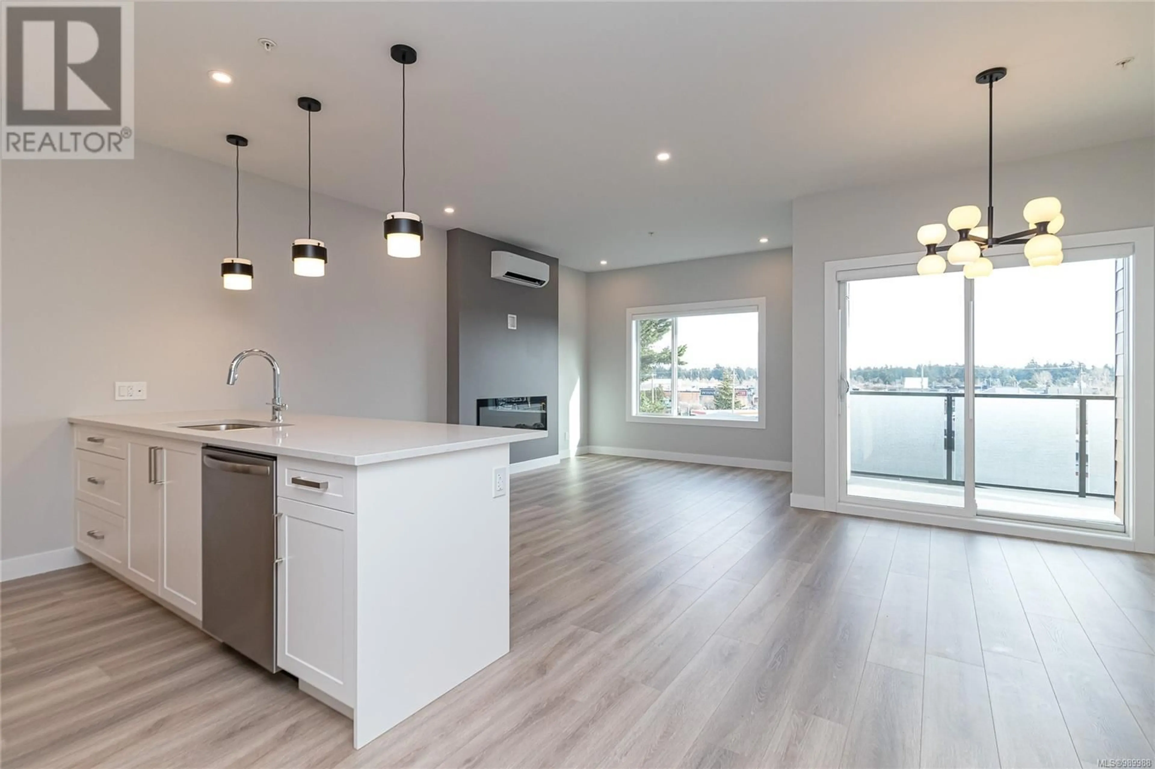 Open concept kitchen, wood/laminate floor for 204 - 924 JENKINS AVENUE, Langford British Columbia V9B2N7