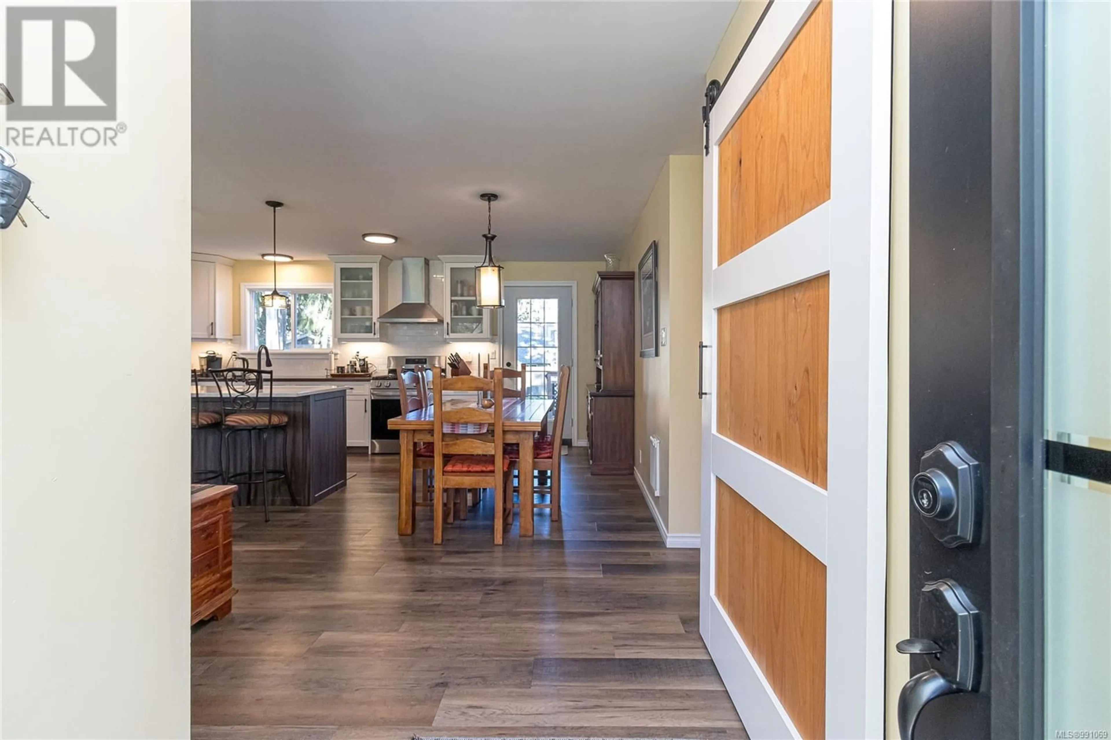 Open concept kitchen, wood/laminate floor for 7500 Forest Turn Rd, Lantzville British Columbia V0R2H0