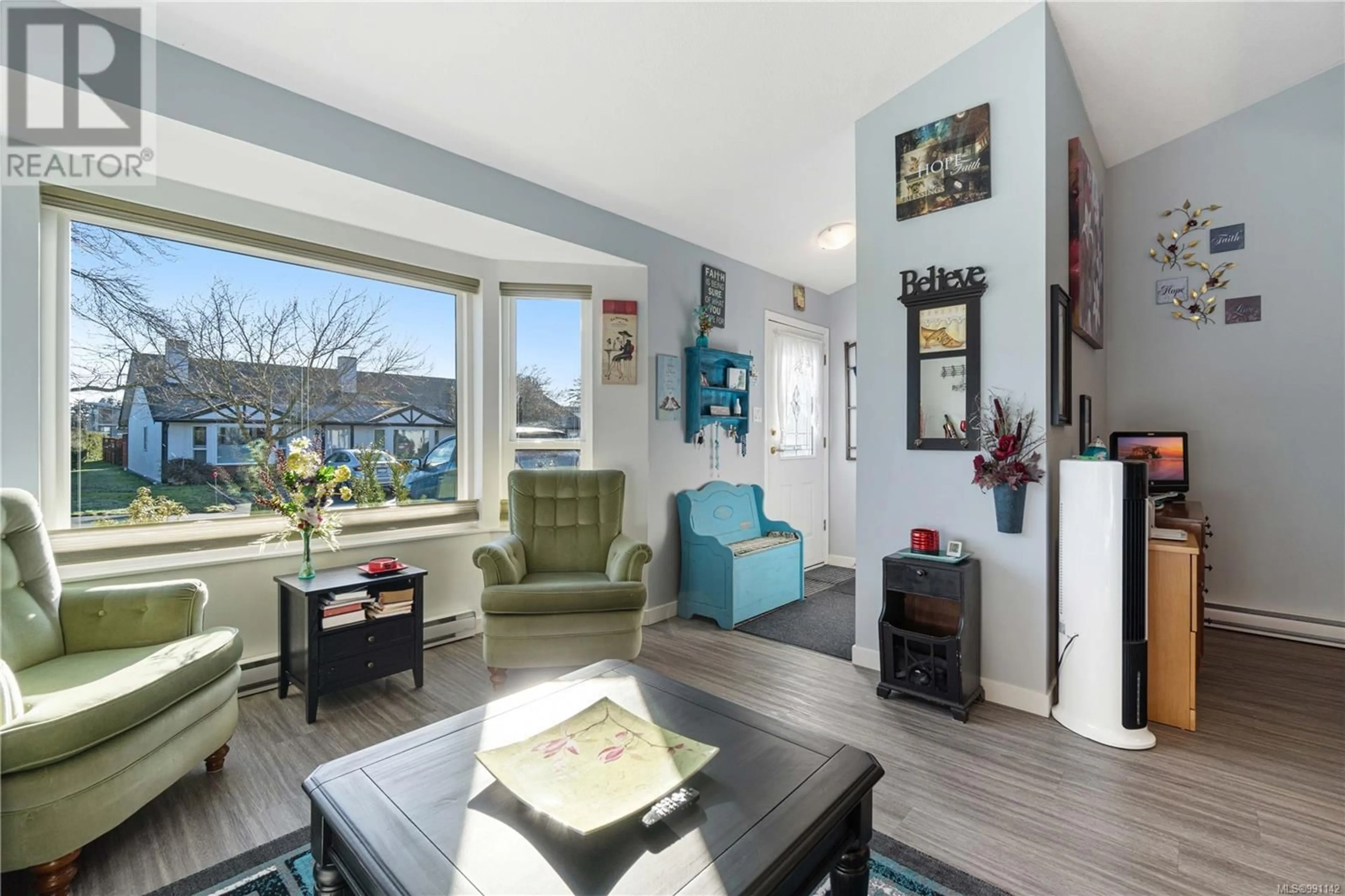 Living room with furniture, wood/laminate floor for 65 - 120 FINHOLM STREET, Parksville British Columbia V9P1J6