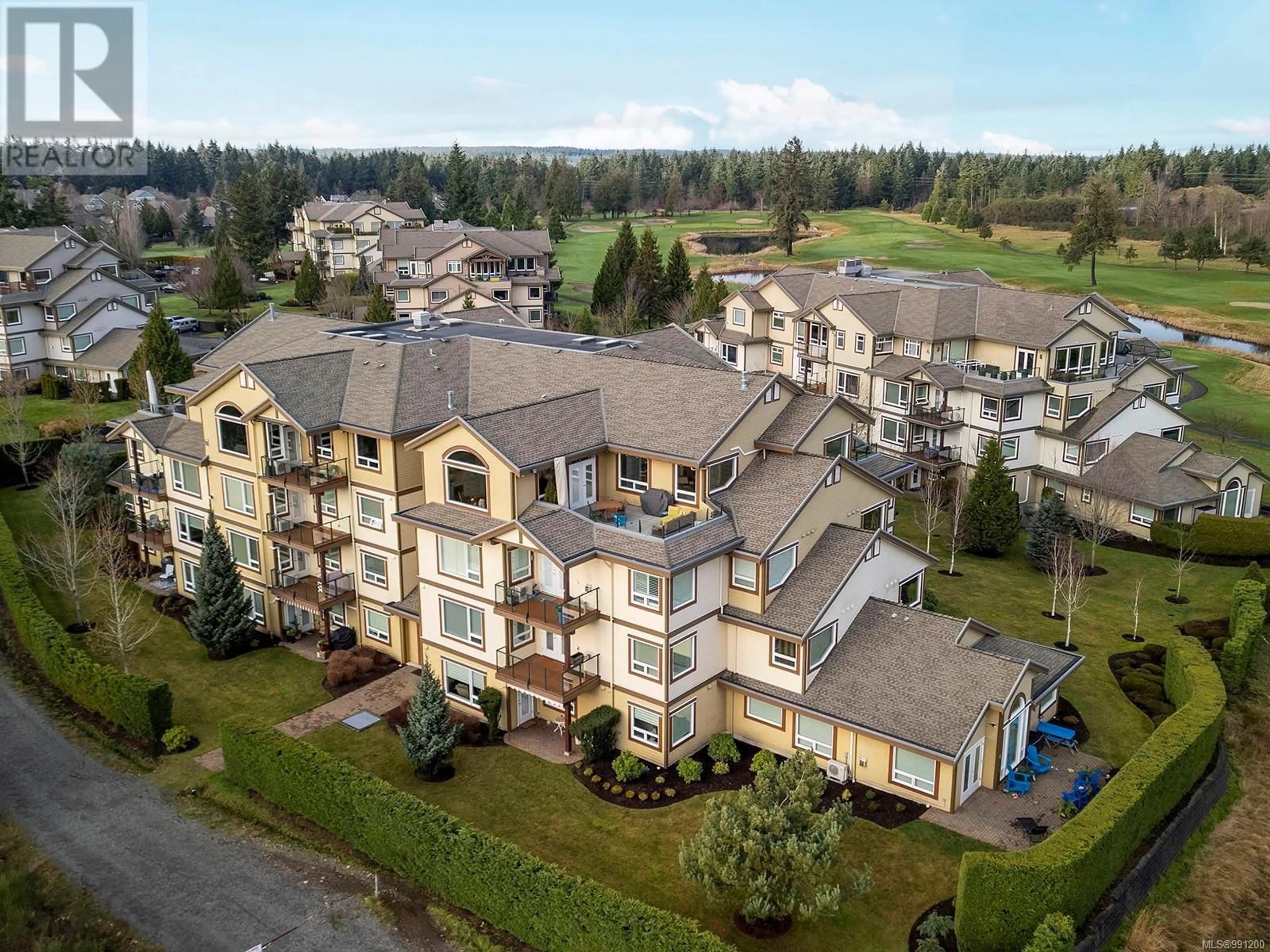 A pic from outside/outdoor area/front of a property/back of a property/a pic from drone, mountain view for 643 3666 Royal Vista Way, Courtenay British Columbia V9N9X8