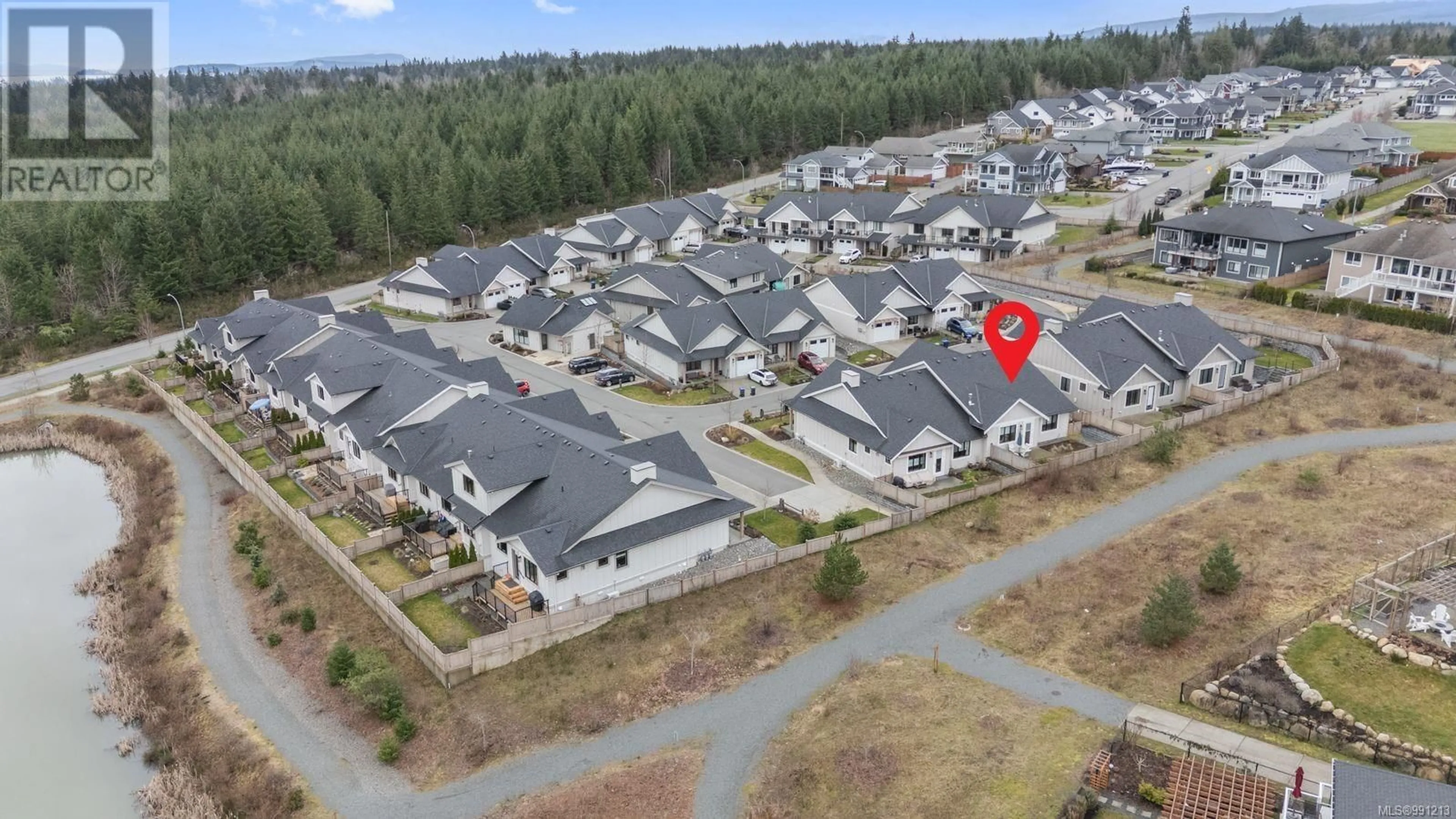 A pic from outside/outdoor area/front of a property/back of a property/a pic from drone, street for 121 4098 Buckstone Rd, Courtenay British Columbia V9N0H2