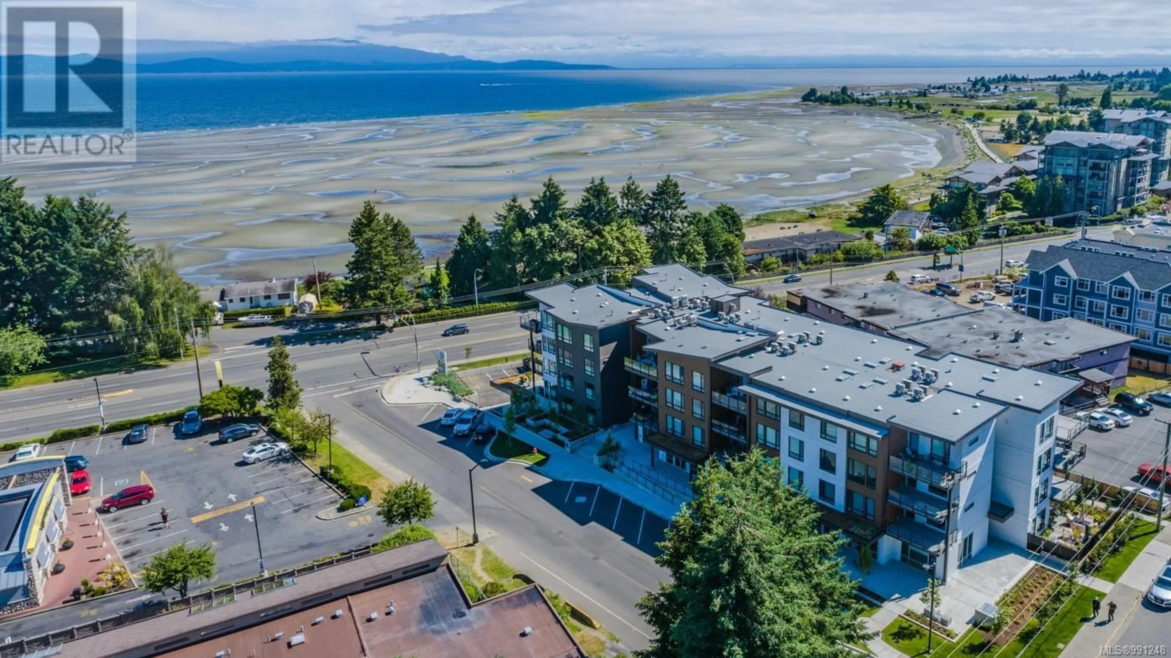 A pic from outside/outdoor area/front of a property/back of a property/a pic from drone, water/lake/river/ocean view for 201 100 Lombardy St, Parksville British Columbia V9P0G4